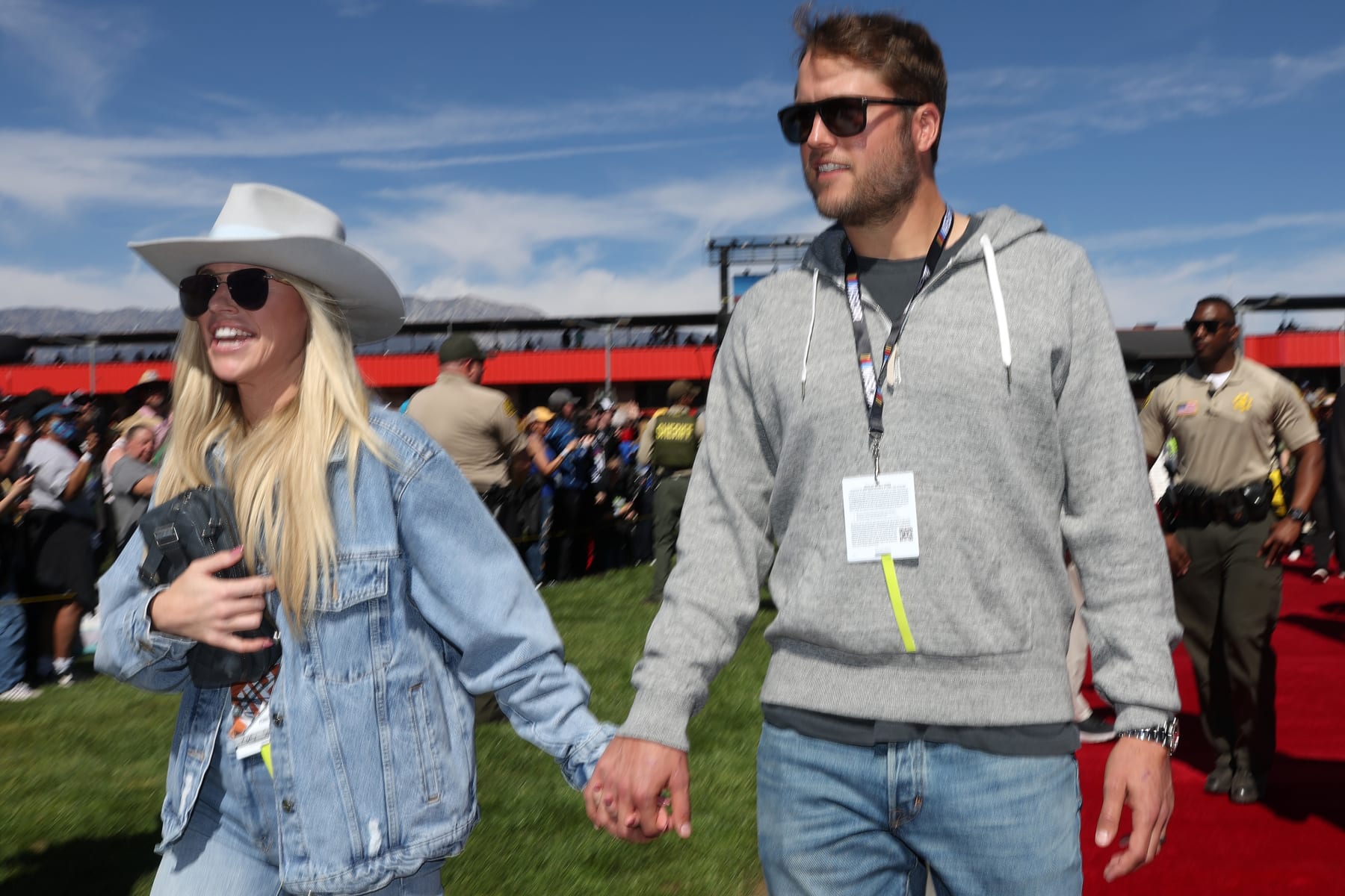 FONTANA, CALIFORNIA - FEBRUARY 27: Los Angeles Rams quarterback Matthew Stafford (R) and wife Kelly Stafford walk the red carpet prior to the NASCAR Cup Series Wise Power 400 at Auto Club Speedway on February 27, 2022 in Fontana, California. (Photo by James Gilbert/Getty Images)