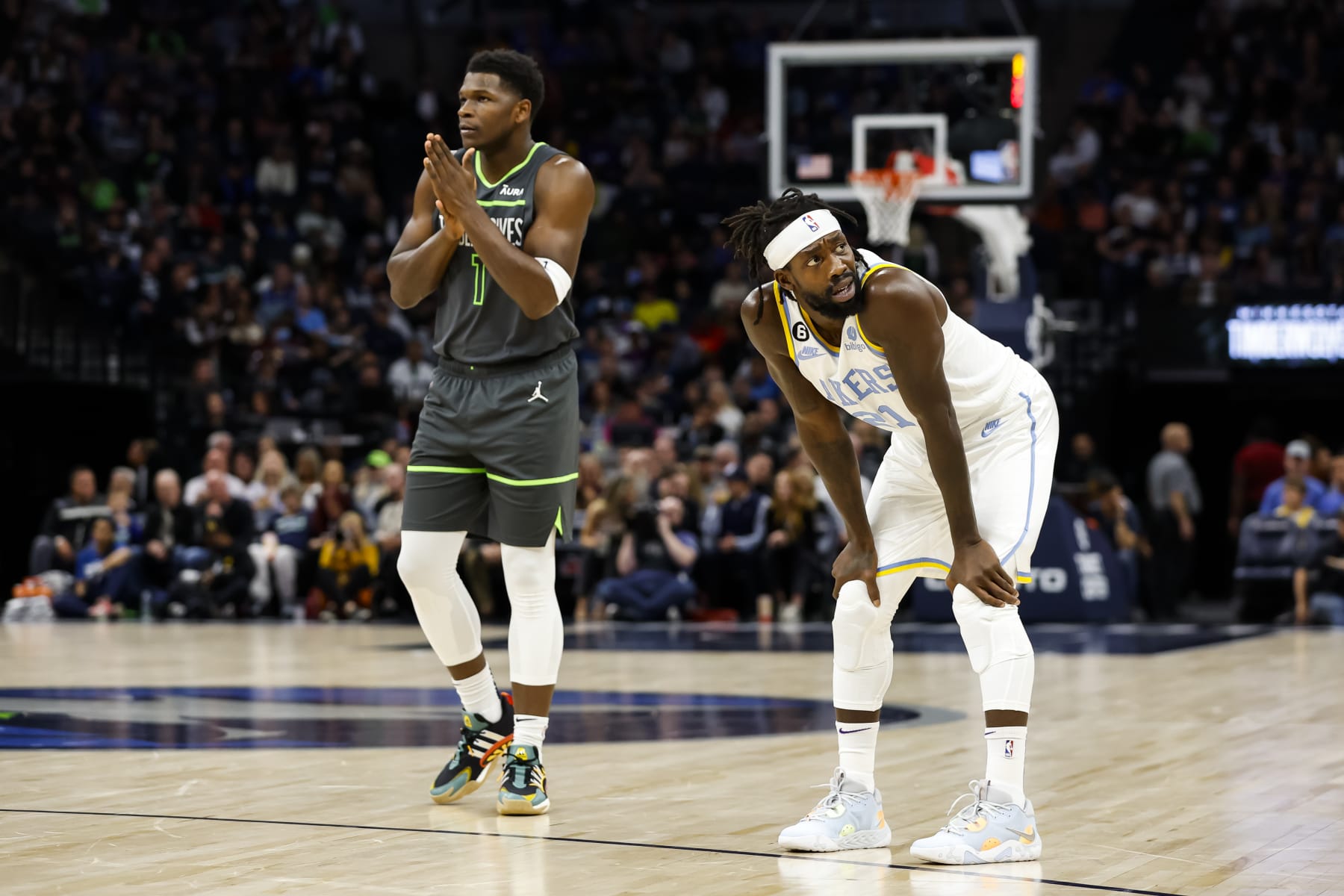 MINNEAPOLIS, MN - OCTOBER 28: Anthony Edwards #1 of the Minnesota Timberwolves and Patrick Beverley #21 of the Los Angeles Lakers look on in the first quarter of the game at Target Center on October 28, 2022 in Minneapolis, Minnesota. The Timberwolves defeated the Lakers 111-102. NOTE TO USER: User expressly acknowledges and agrees that, by downloading and or using this Photograph, user is consenting to the terms and conditions of the Getty Images License Agreement. (Photo by David Berding/Getty Images)