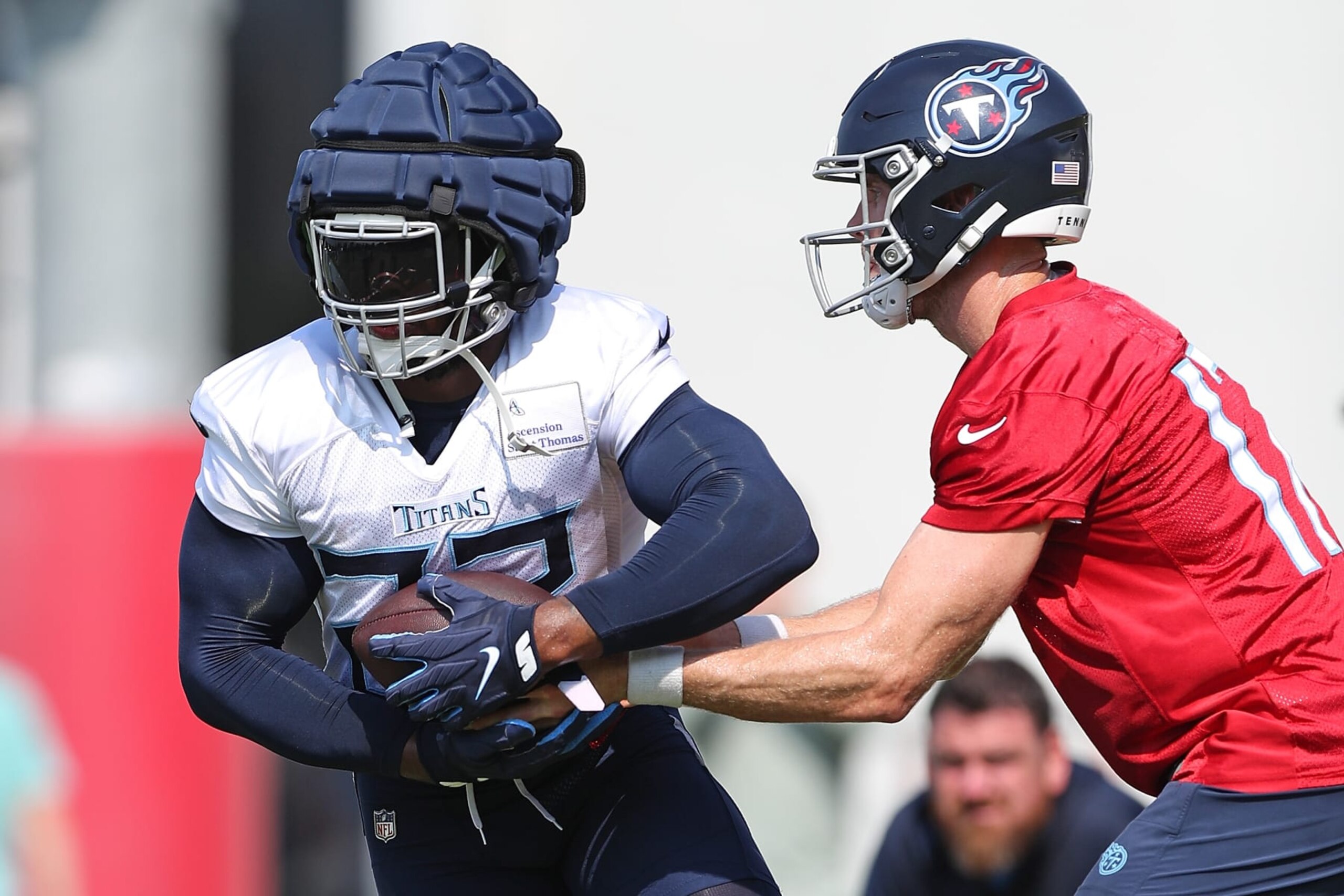 NASHVILLE, TENNESSEE - JULY 29: Ryan Tannehill #17 of the Tennessee Titans hands the ball off to Derrick Henry #22 of the Tennessee Titans during training camp at Ascension Saint Thomas Sports Park on July 29, 2023 in Nashville, Tennessee. (Photo by Justin Ford/Getty Images)