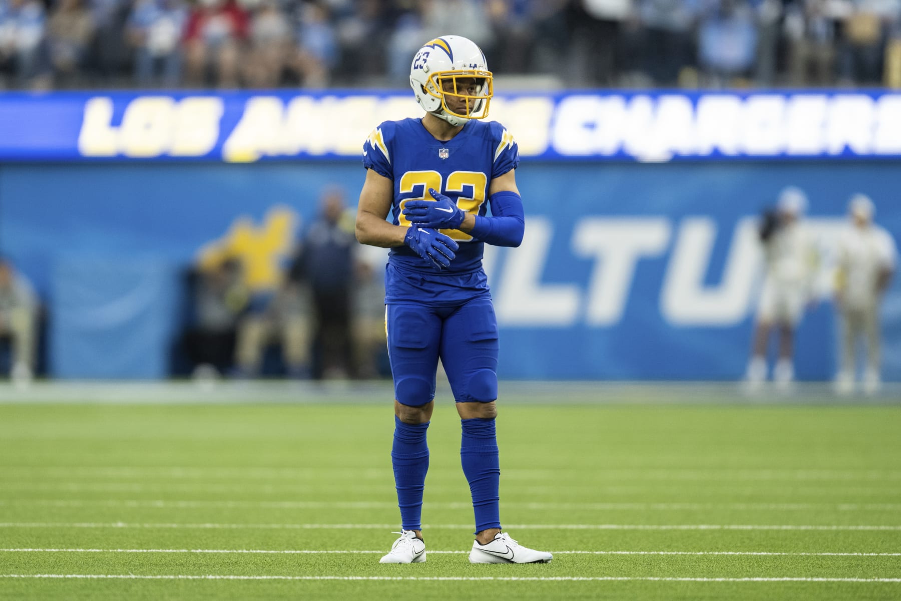 Los Angeles Chargers cornerback Bryce Callahan (23) fixes his glove during an NFL football game against the Tennessee Titans, Sunday, Dec. 18, 2022, in Inglewood, Calif. (AP Photo/Kyusung Gong)