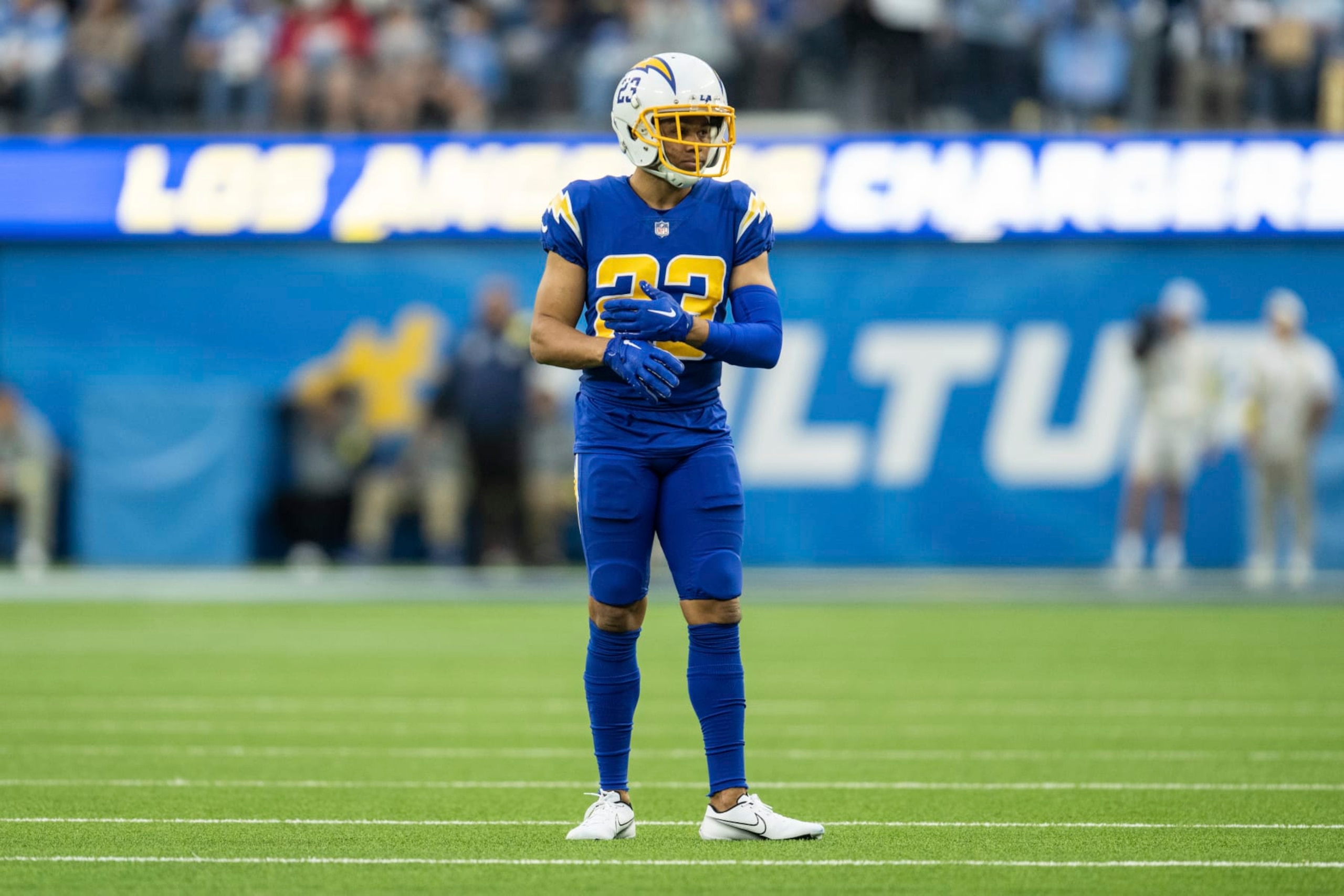 Los Angeles Chargers cornerback Bryce Callahan (23) fixes his glove during an NFL football game against the Tennessee Titans, Sunday, Dec. 18, 2022, in Inglewood, Calif. (AP Photo/Kyusung Gong)