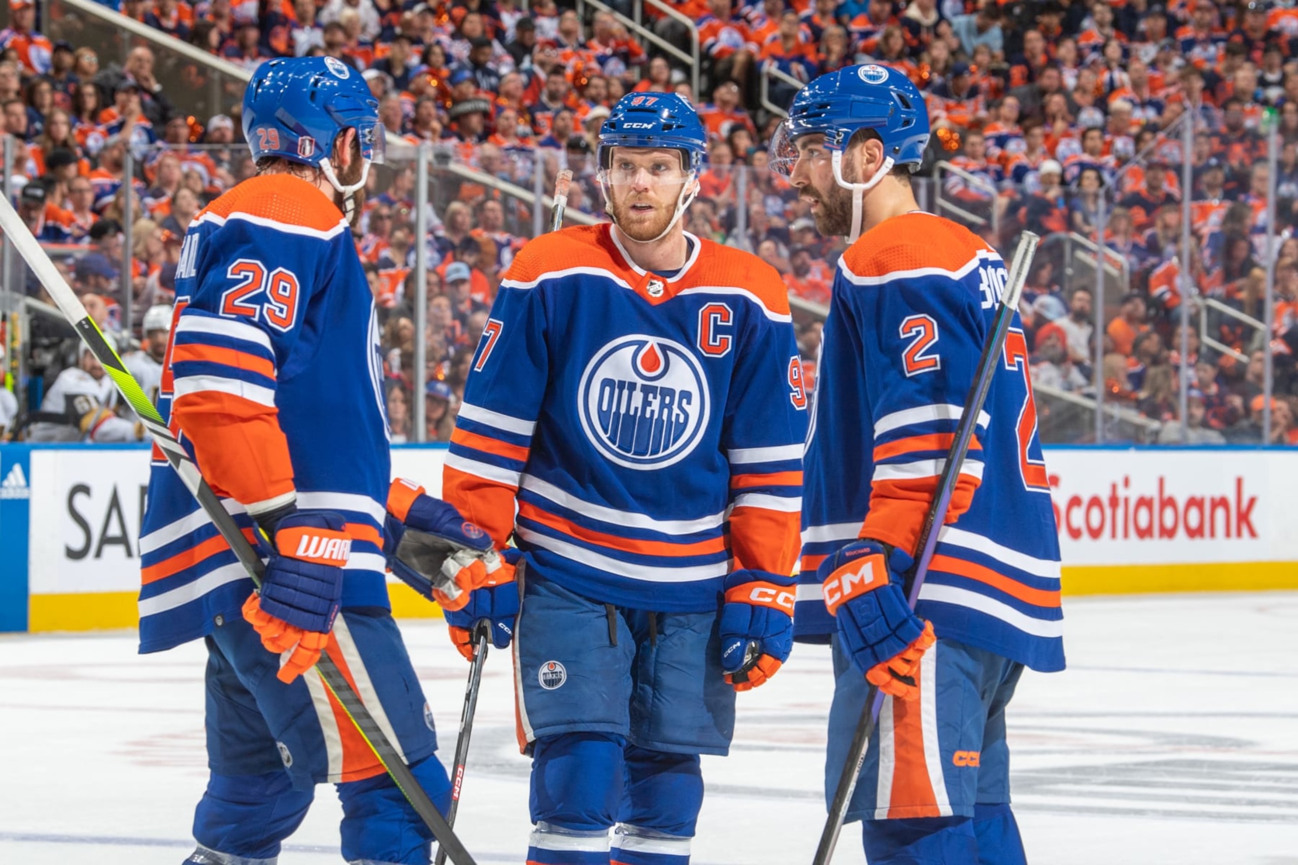 EDMONTON, CANADA - MAY 14 Connor McDavid #97, Leon Draisaitl #29 and Evan Bouchard #2 of the Edmonton Oilers have a discussion during a stoppage in play in Game Six of the Second Round of the 2023 Stanley Cup Playoffs against the Vegas Golden Knights at Rogers Place on May 14, 2023, in Edmonton, Alberta, Canada. (Photo by Andy Devlin/NHLI via Getty Images)