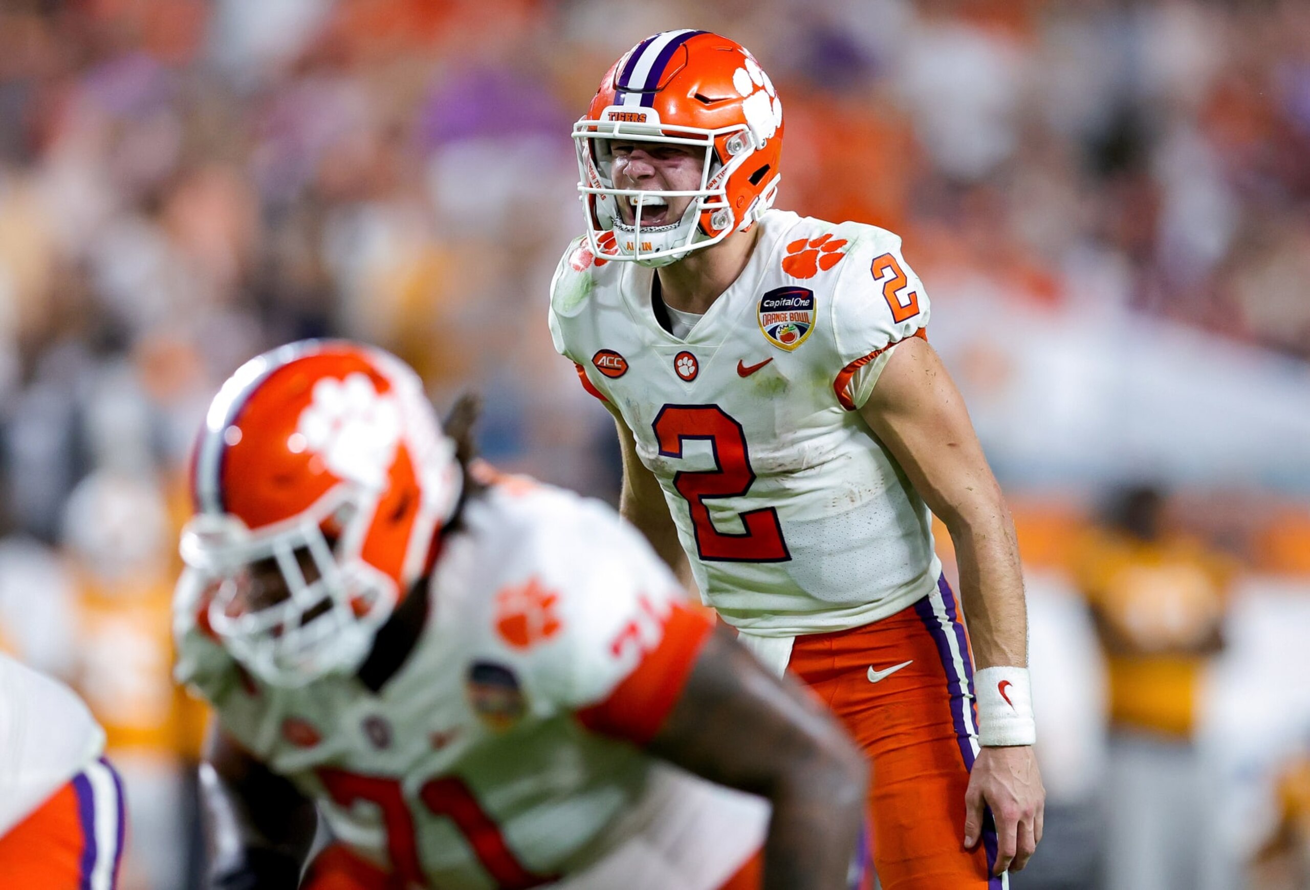 MIAMI GARDENS, FLORIDA - DECEMBER 30: Cade Klubnik #2 of the Clemson Tigers looks on at the line of scrimmage against the Tennessee Volunteers during the second half in theCapital One Orange Bowl at Hard Rock Stadium on December 30, 2022 in Miami Gardens, Florida. (Photo by Megan Briggs/Getty Images)