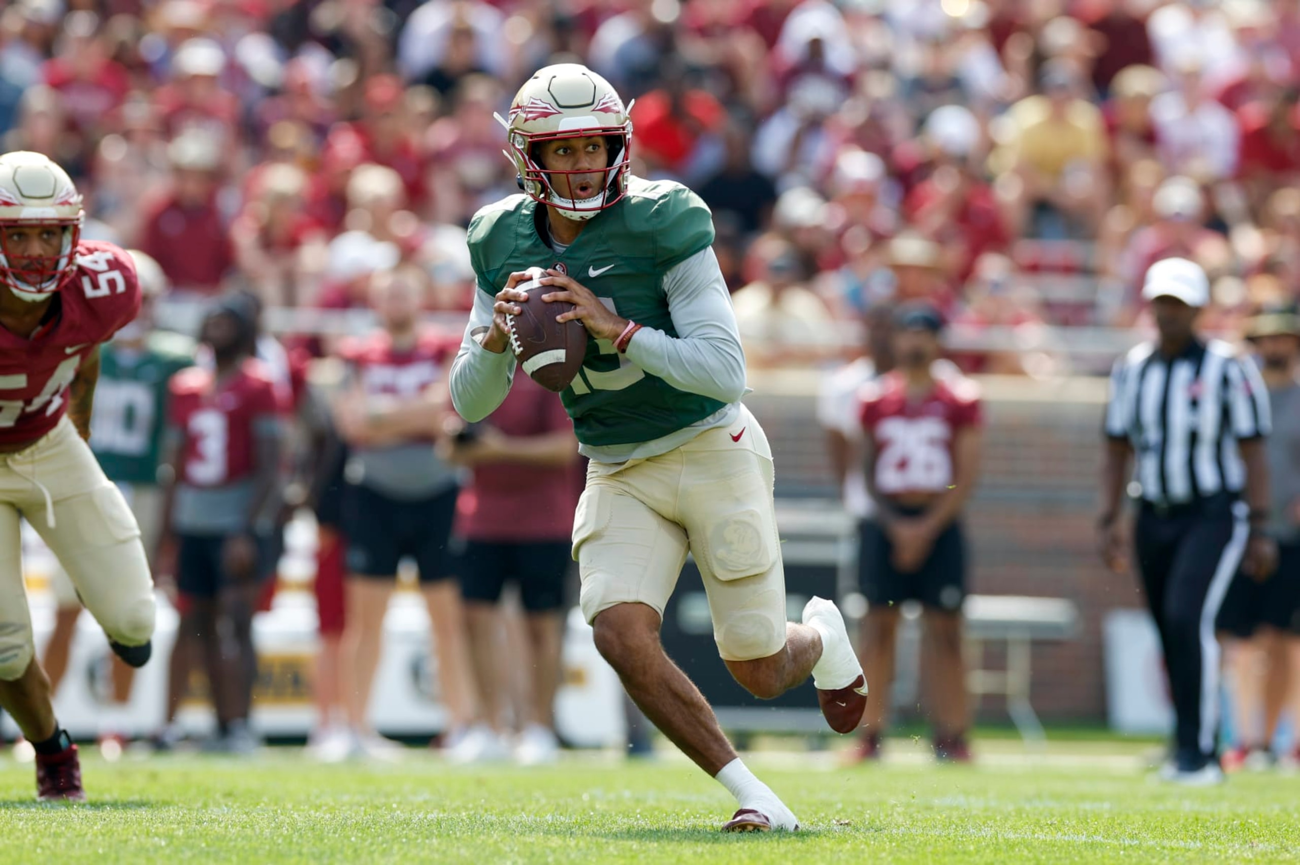 TALLAHASSEE, FL - APRIL 15: Florida State Seminoles quarterback Jordan Travis (13) runs with the ball during the Florida State Garnet & Gold Spring Showcase on April 15, 2023 at Bobby Bowden Field at Doak Campbell Stadium in Tallahassee, Fl. (Photo by David Rosenblum/Icon Sportswire via Getty Images)