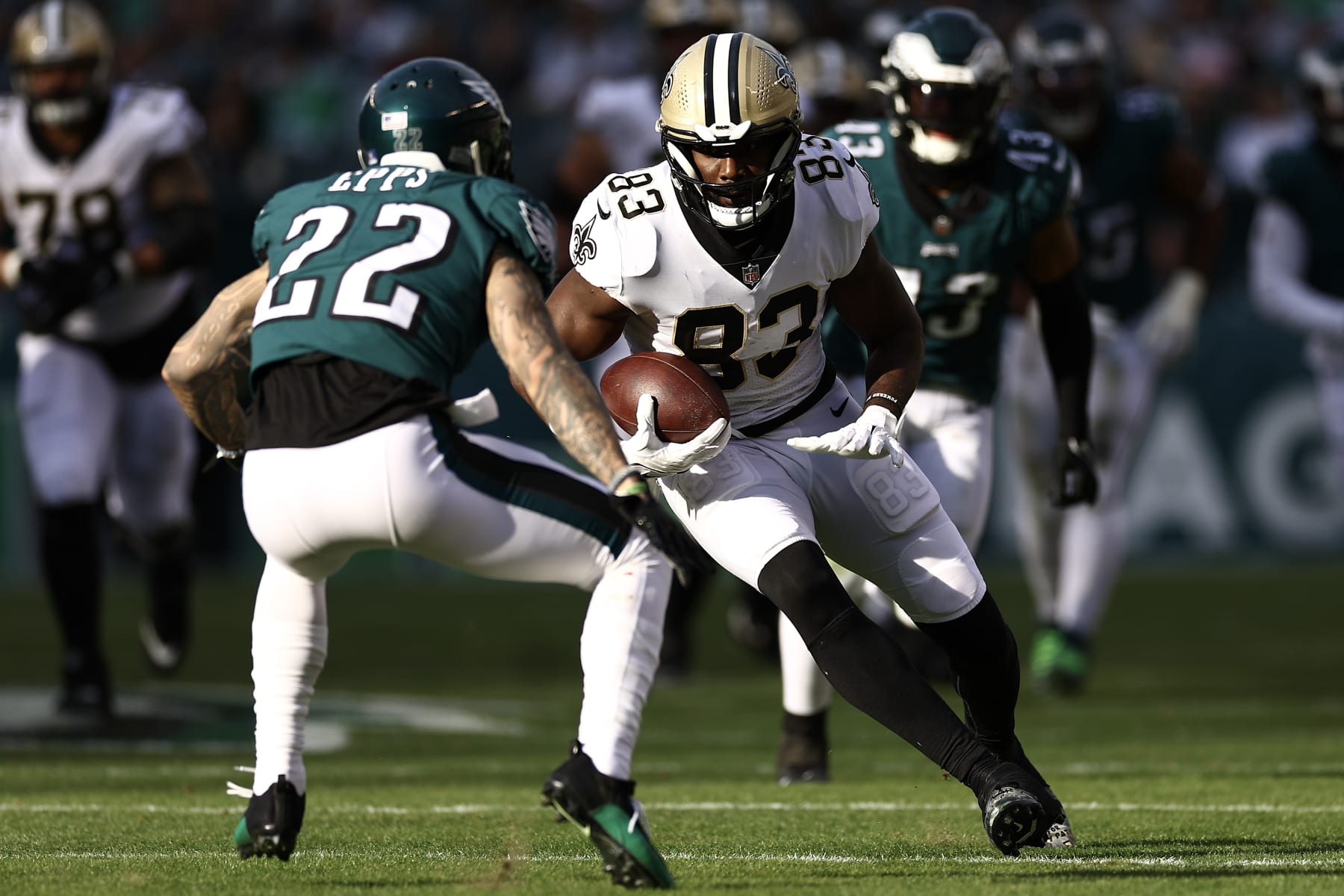 PHILADELPHIA, PENNSYLVANIA - JANUARY 01: Juwan Johnson #83 of the New Orleans Saints makes a reception against Marcus Epps #22 of the Philadelphia Eagles during the second quarter at Lincoln Financial Field on January 01, 2023 in Philadelphia, Pennsylvania. (Photo by Tim Nwachukwu/Getty Images)
