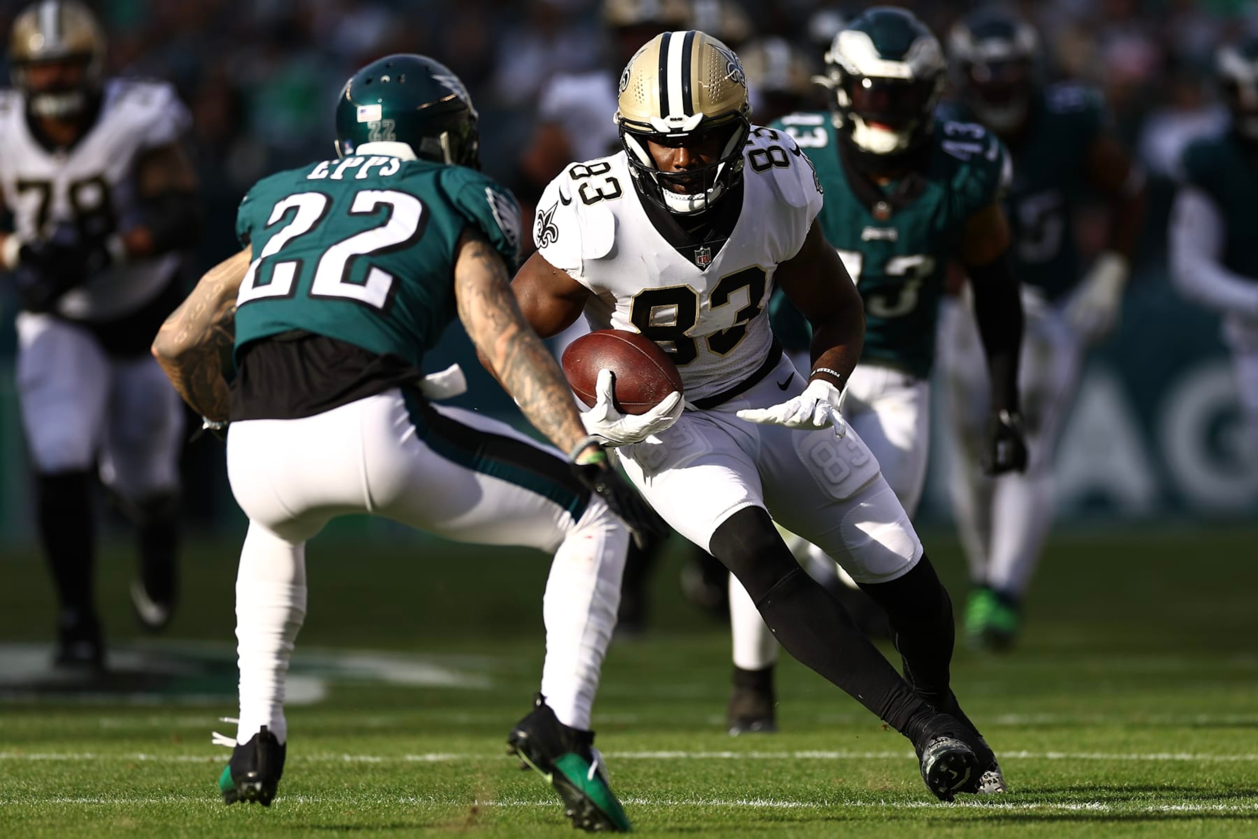 PHILADELPHIA, PENNSYLVANIA - JANUARY 01: Juwan Johnson #83 of the New Orleans Saints makes a reception against Marcus Epps #22 of the Philadelphia Eagles during the second quarter at Lincoln Financial Field on January 01, 2023 in Philadelphia, Pennsylvania. (Photo by Tim Nwachukwu/Getty Images)