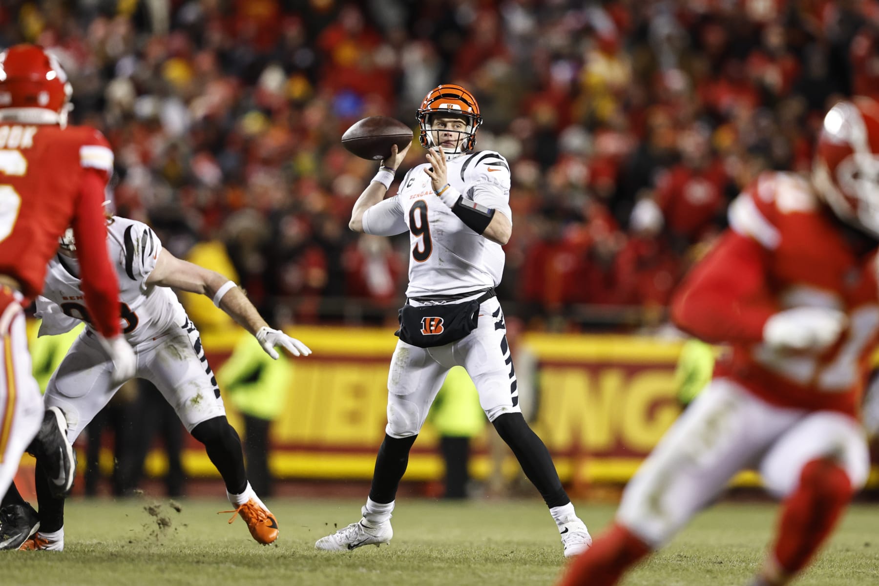KANSAS CITY, MISSOURI - JANUARY 29: Joe Burrow #9 of the Cincinnati Bengals passes the ball during the AFC Championship NFL football game between the Kansas City Chiefs and the Cincinnati Bengals at GEHA Field at Arrowhead Stadium on January 29, 2023 in Kansas City, Missouri. (Photo by Michael Owens/Getty Images)