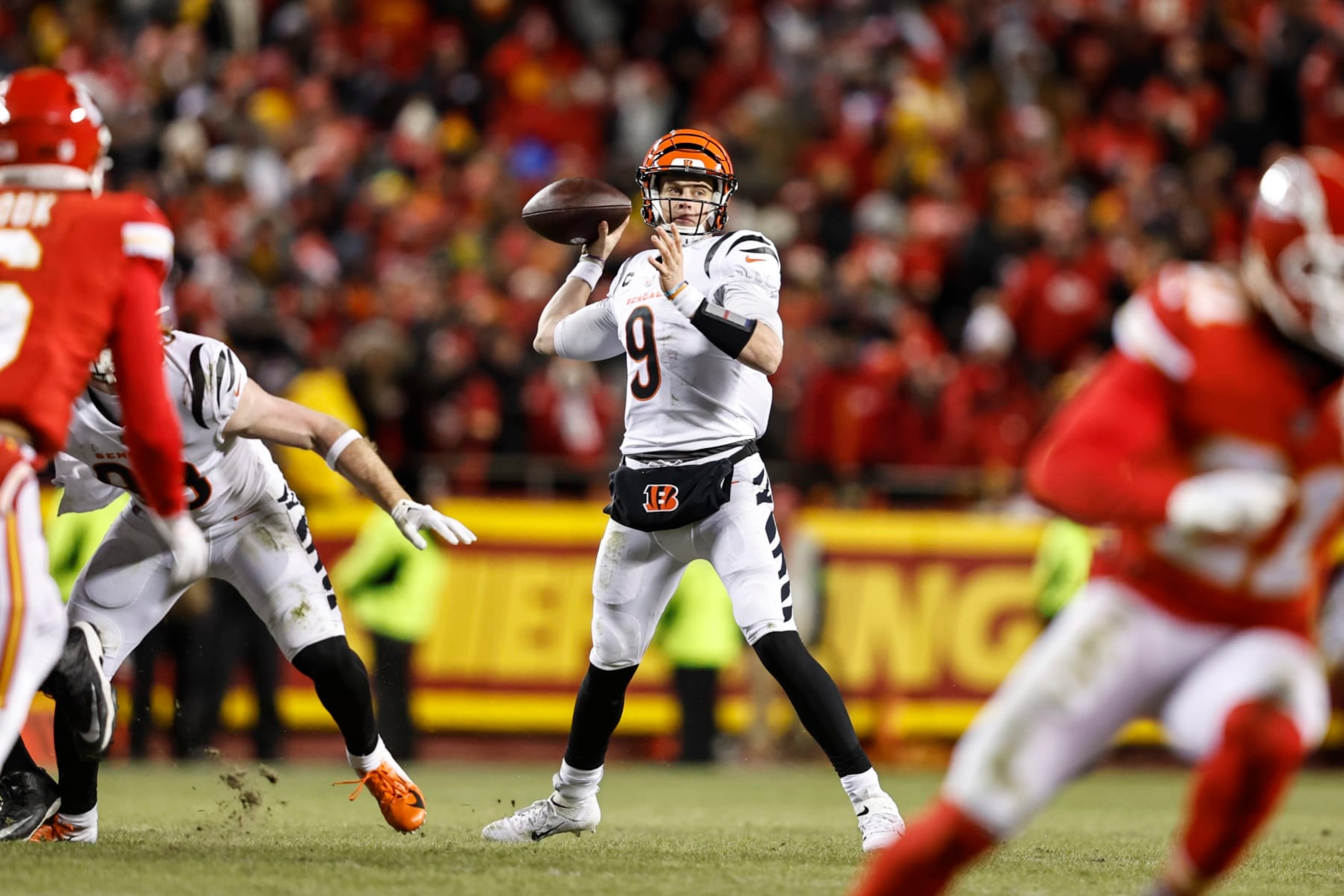 KANSAS CITY, MISSOURI - JANUARY 29: Joe Burrow #9 of the Cincinnati Bengals passes the ball during the AFC Championship NFL football game between the Kansas City Chiefs and the Cincinnati Bengals at GEHA Field at Arrowhead Stadium on January 29, 2023 in Kansas City, Missouri. (Photo by Michael Owens/Getty Images)