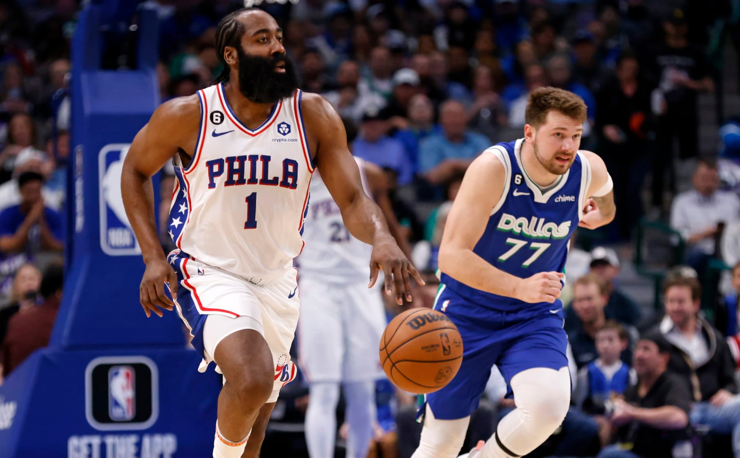 DALLAS, TX - MARCH 2: James Harden #1 of the Philadelphia 76ers brings the ball up the court as Luka Doncic #77 of the Dallas Mavericks gets back on defense in the first half at American Airlines Center on March 2, 2023 in Dallas, Texas. NOTE TO USER: User expressly acknowledges and agrees that, by downloading and or using this photograph, User is consenting to the terms and conditions of the Getty Images License Agreement. (Photo by Ron Jenkins/Getty Images)