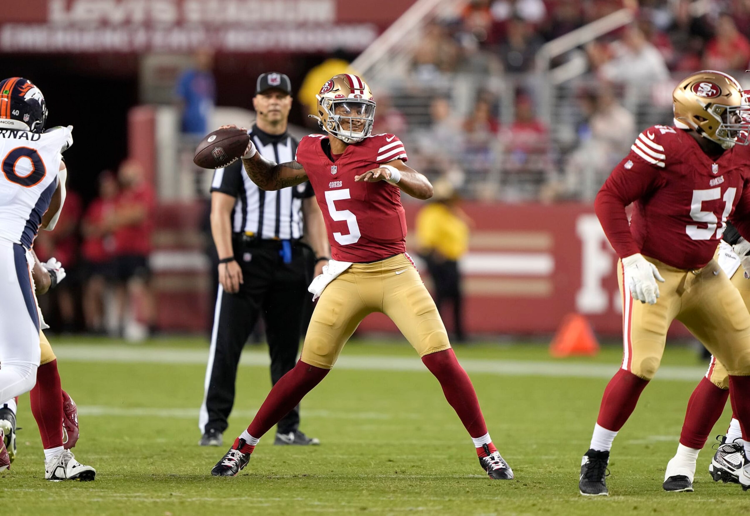 SANTA CLARA, CALIFORNIA - AUGUST 19: Trey Lance #5 of the San Francisco 49ers looks to pass the ball against the Denver Broncos in the fourth quarter at Levi's Stadium on August 19, 2023 in Santa Clara, California. (Photo by Thearon W. Henderson/Getty Images)