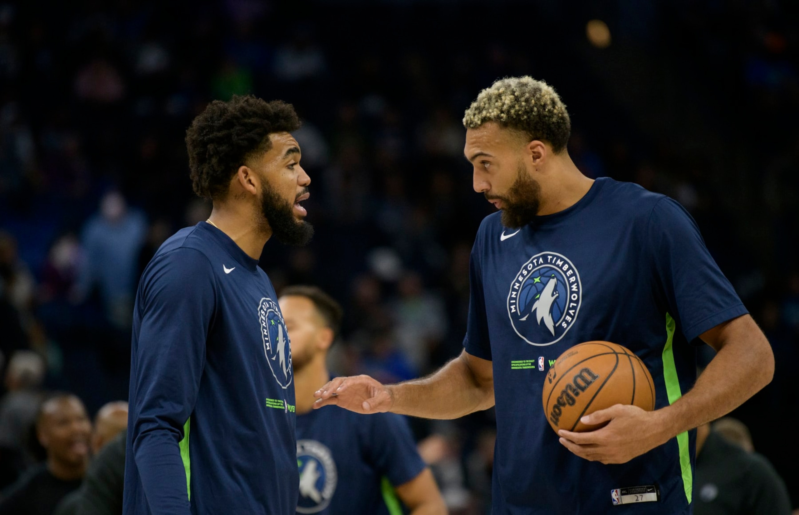 MINNEAPOLIS, MN - OCTOBER 21: Karl-Anthony Towns #32 of the Minnesota Timberwolves speaks with Rudy Gobert #27 before the game against the Utah Jazz at Target Center on October 21, 2022 in Minneapolis, Minnesota. NOTE TO USER: User expressly acknowledges and agrees that, by downloading and or using this photograph, User is consenting to the terms and conditions of the Getty Images License Agreement. (Photo by Stephen Maturen/Getty Images)