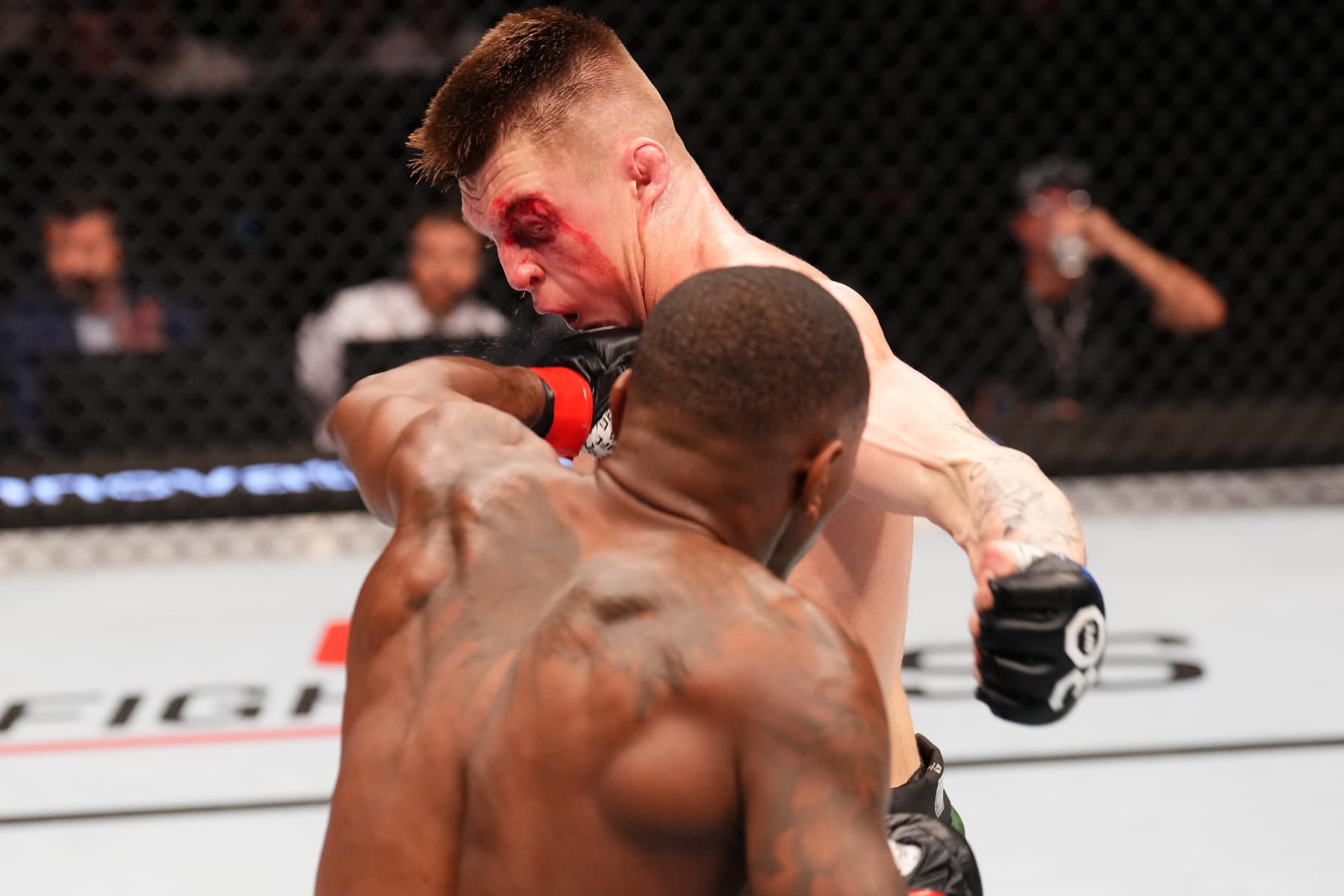 PARIS, FRANCE - SEPTEMBER 02: (L-R) Taylor Lapilus of France punches Caolan Loughran of Northern Ireland in a bantamweight fight during the UFC Fight Night event at The Accor Arena on September 02, 2023 in Paris, France. (Photo by Josh Hedges/Zuffa LLC via Getty Images)