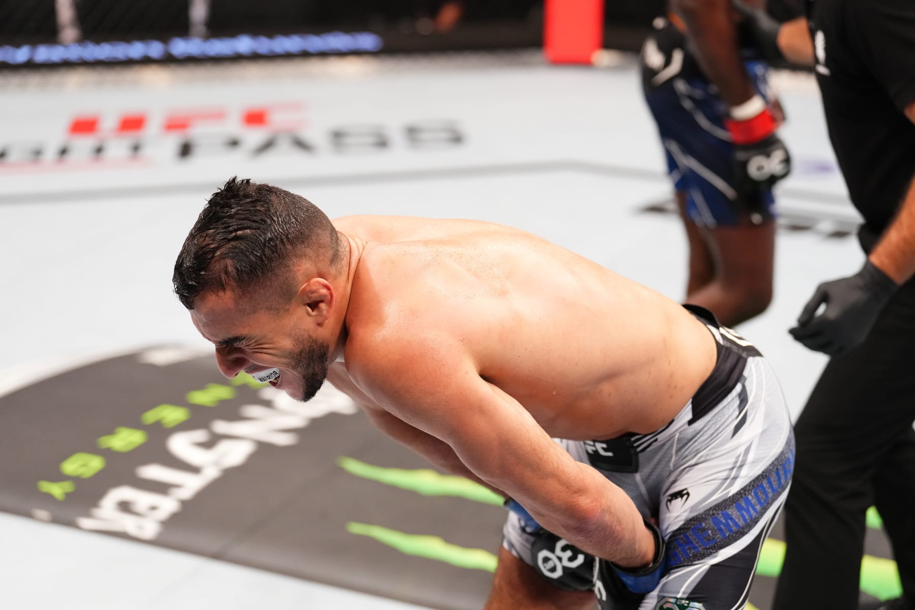 PARIS, FRANCE - SEPTEMBER 02: Yanis Ghemmouri of France reacts after receiving a kick to the lower torso against William Gomis of France in a featherweight fight during the UFC Fight Night event at The Accor Arena on September 02, 2023 in Paris, France. (Photo by Josh Hedges/Zuffa LLC via Getty Images)