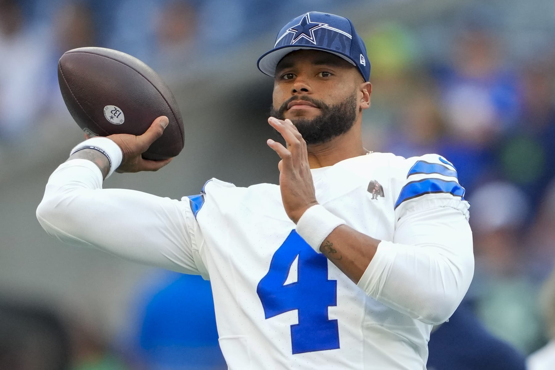 Dallas Cowboys quarterback Dak Prescott warms up before a preseason NFL football game against the Seattle Seahawks Saturday, Aug. 19, 2023, in Seattle. (AP Photo/Lindsey Wasson)