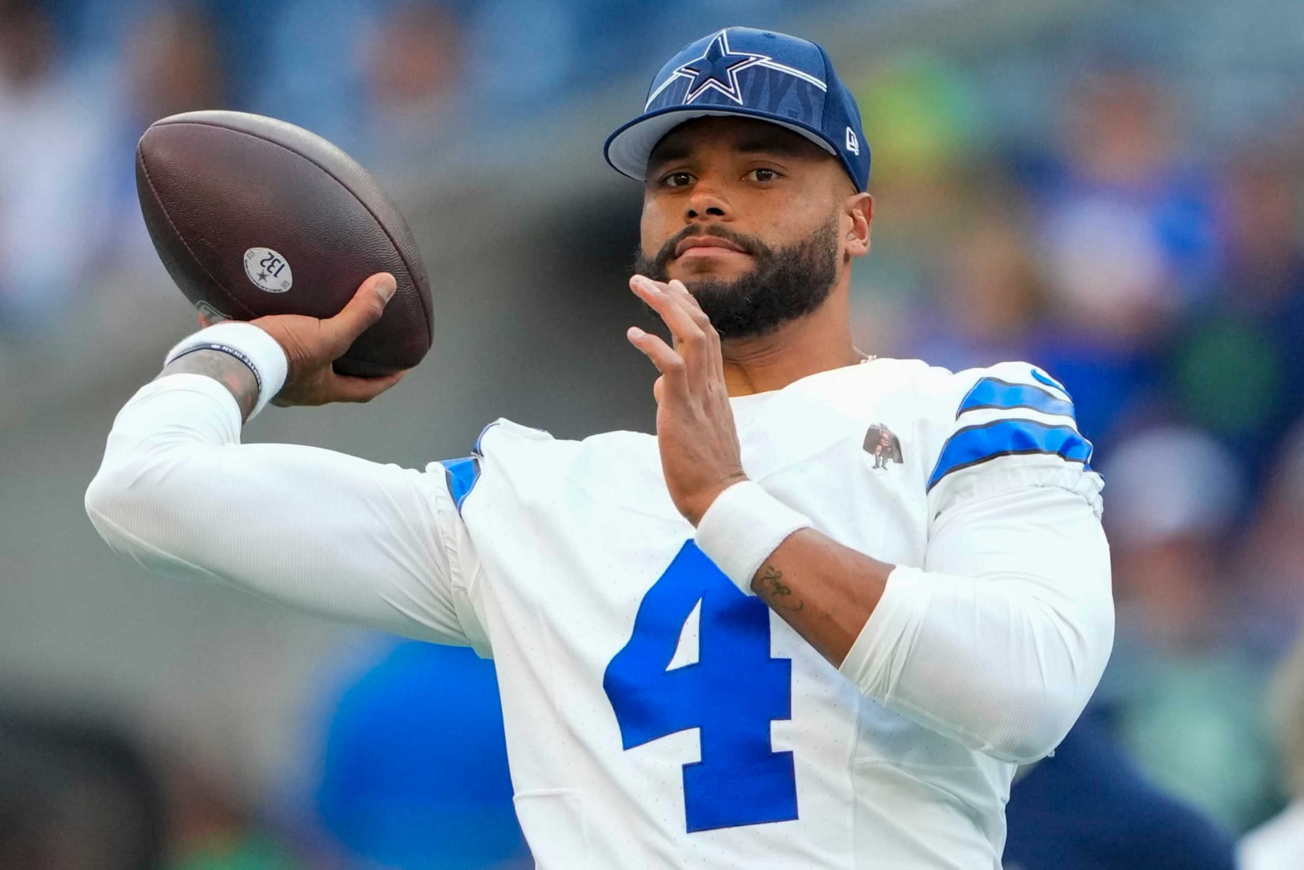 Dallas Cowboys quarterback Dak Prescott warms up before a preseason NFL football game against the Seattle Seahawks Saturday, Aug. 19, 2023, in Seattle. (AP Photo/Lindsey Wasson)