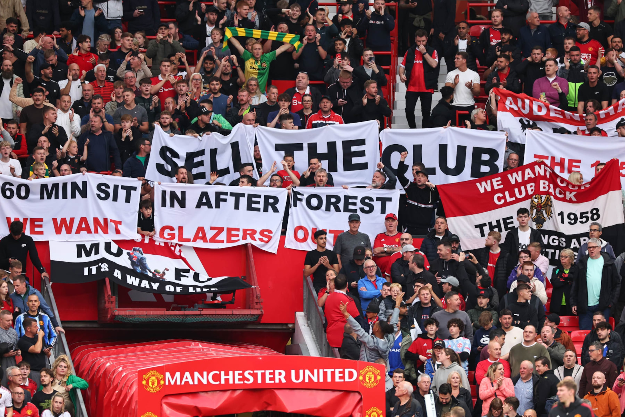 MANCHESTER, ENGLAND - AUGUST 14: Fans of Manchester United protest against the owners, the Glazer family during the Premier League match between Manchester United and Wolverhampton Wanderers at Old Trafford on August 14, 2023 in Manchester, England. (Photo by Robbie Jay Barratt - AMA/Getty Images)