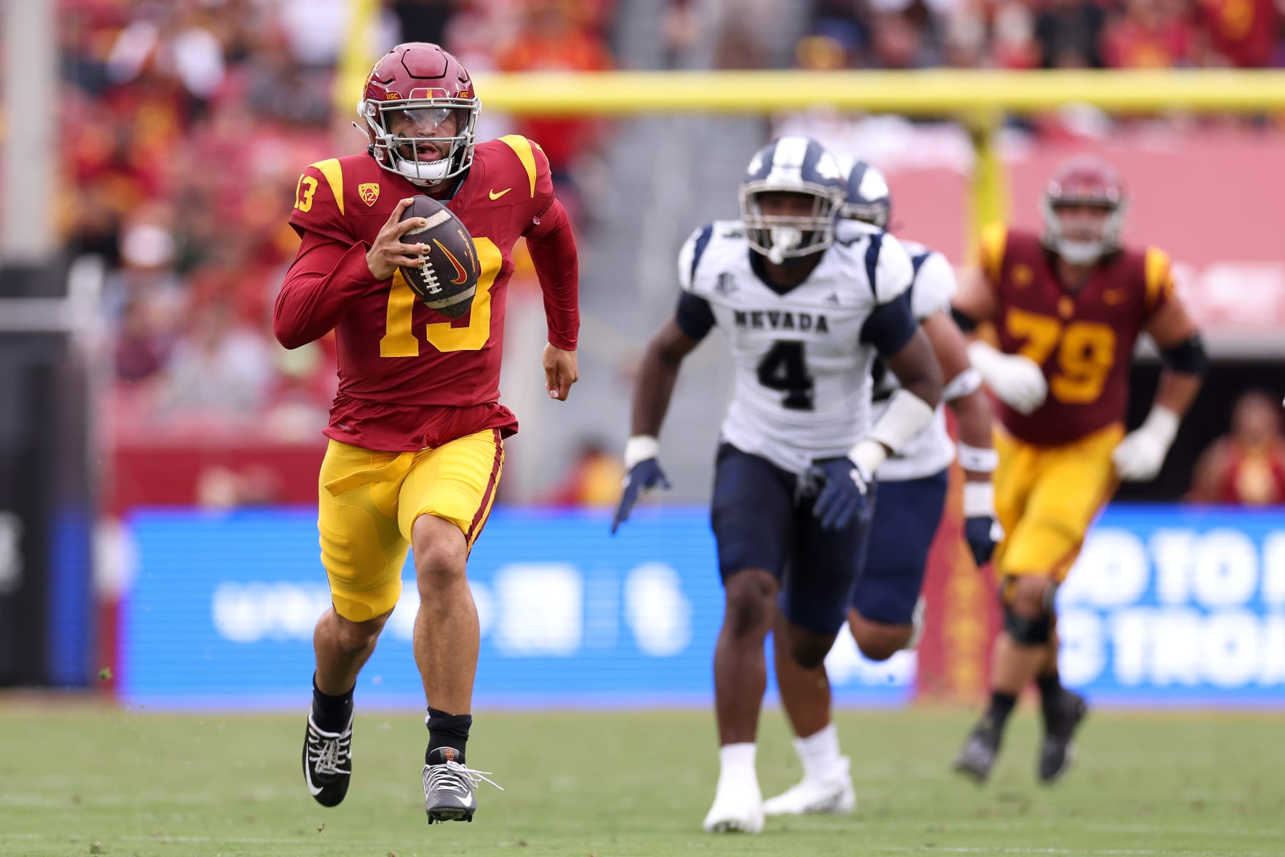 LOS ANGELES, CALIFORNIA - SEPTEMBER 02: Caleb Williams #13 of the USC Trojans runs the ball during the second quarter against the Nevada Wolf Pack at United Airlines Field at the Los Angeles Memorial Coliseum on September 02, 2023 in Los Angeles, California. (Photo by Katelyn Mulcahy/Getty Images)
