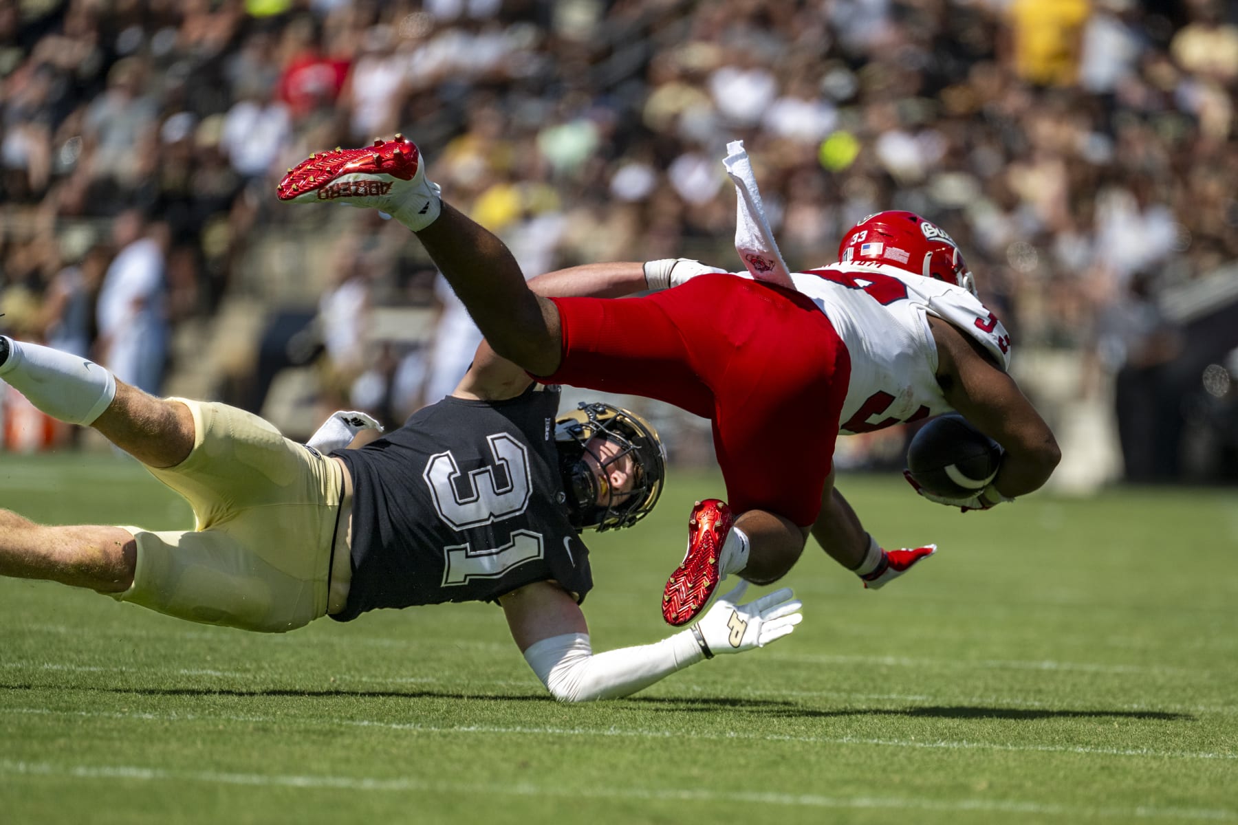 Purdue defensive back Dillon Thieneman (31) stops a run by Fresno State running back Elijah Gilliam (33) during an NCAA football game on Saturday, Sept. 2, 2023, in West Lafayette, Ind. (AP Photo/Doug McSchooler)