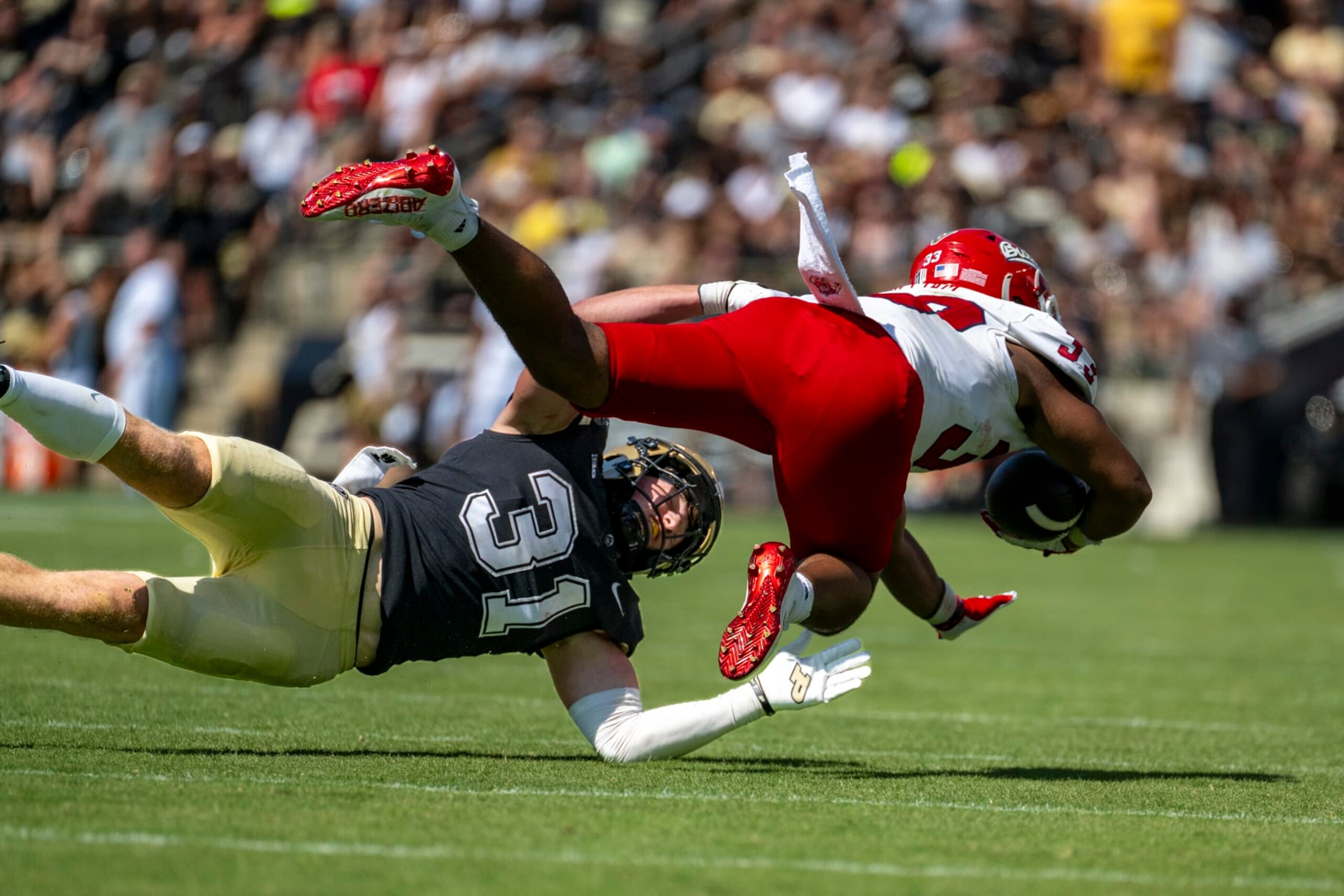 Purdue defensive back Dillon Thieneman (31) stops a run by Fresno State running back Elijah Gilliam (33) during an NCAA football game on Saturday, Sept. 2, 2023, in West Lafayette, Ind. (AP Photo/Doug McSchooler) Purdue defensive back Dillon Thieneman (31) stops a run by Fresno State running back Elijah Gilliam (33) during an NCAA football game on Saturday, Sept. 2, 2023, in West Lafayette, Ind. (AP Photo/Doug McSchooler)