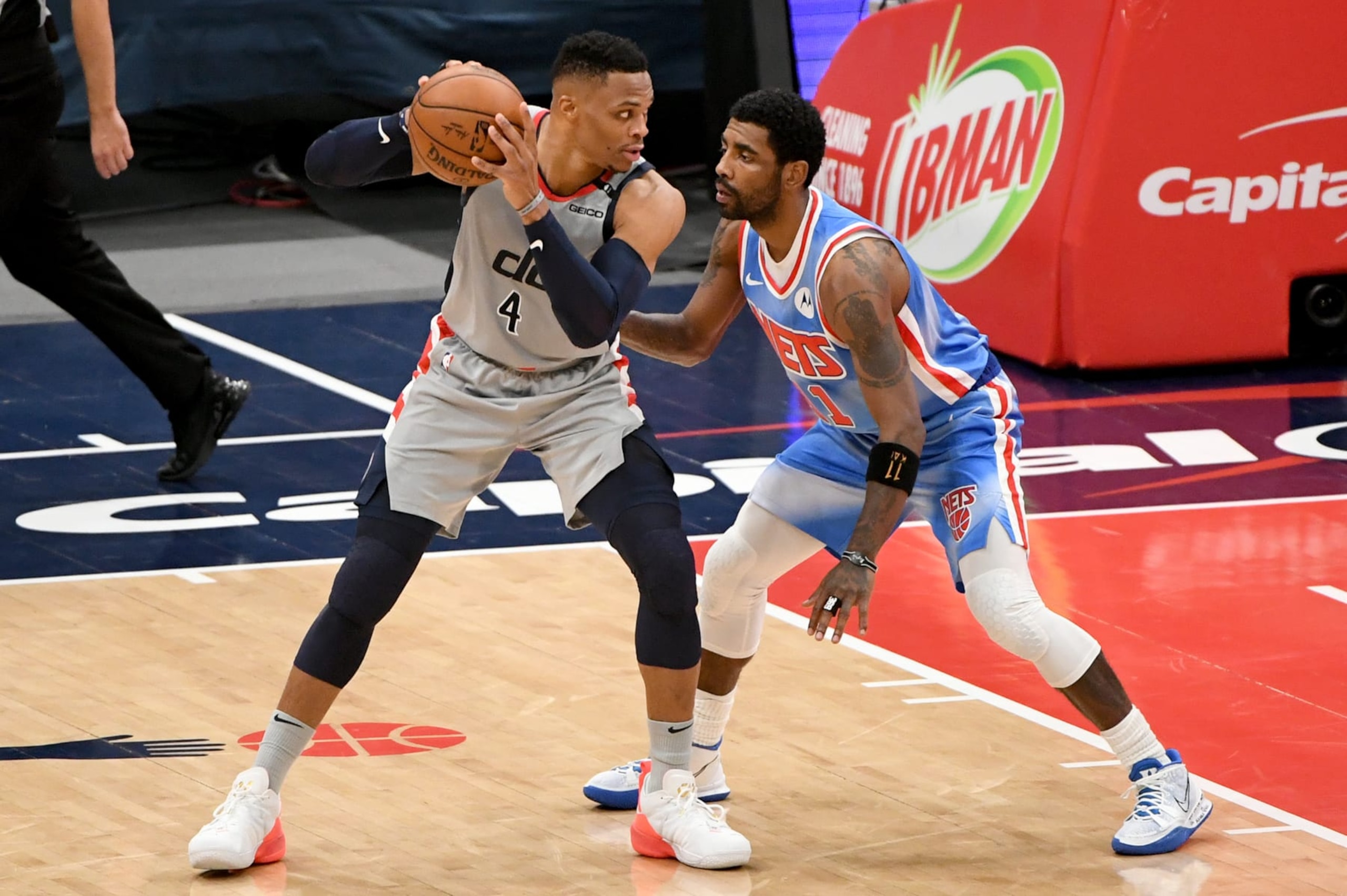 WASHINGTON, DC - JANUARY 31: Russell Westbrook #4 of the Washington Wizards looks to pass as Kyrie Irving #11 of the Brooklyn Nets defends during the first half at Capital One Arena on January 31, 2021 in Washington, DC. NOTE TO USER: User expressly acknowledges and agrees that, by downloading and or using this photograph, User is consenting to the terms and conditions of the Getty Images License Agreement. (Photo by Will Newton/Getty Images)