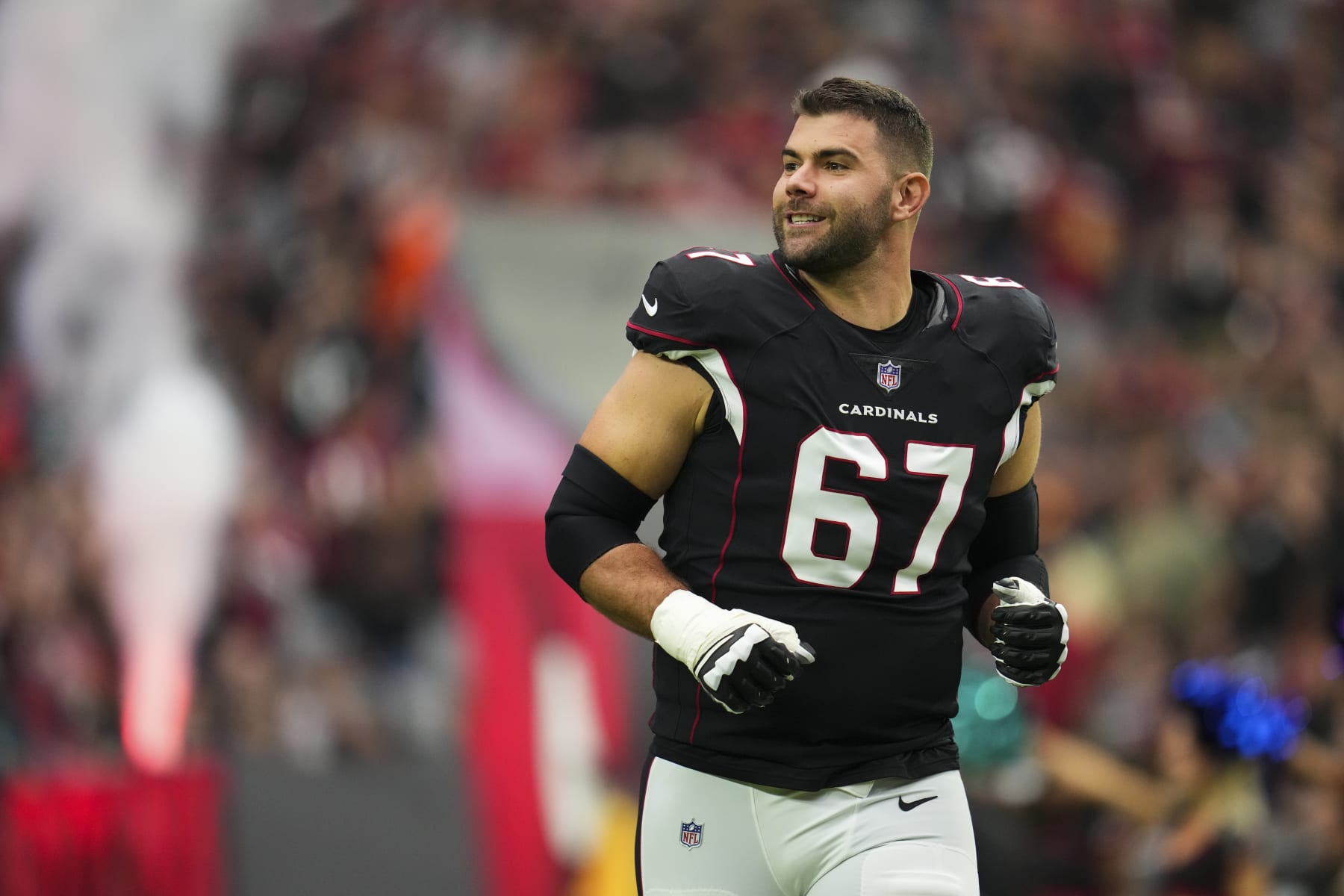 GLENDALE, AZ - OCTOBER 09: Justin Pugh #67 of the Arizona Cardinals runs out during introductions against the Philadelphia Eagles at State Farm Stadium on October 9, 2022 in Glendale, Arizona. (Photo by Cooper Neill/Getty Images)