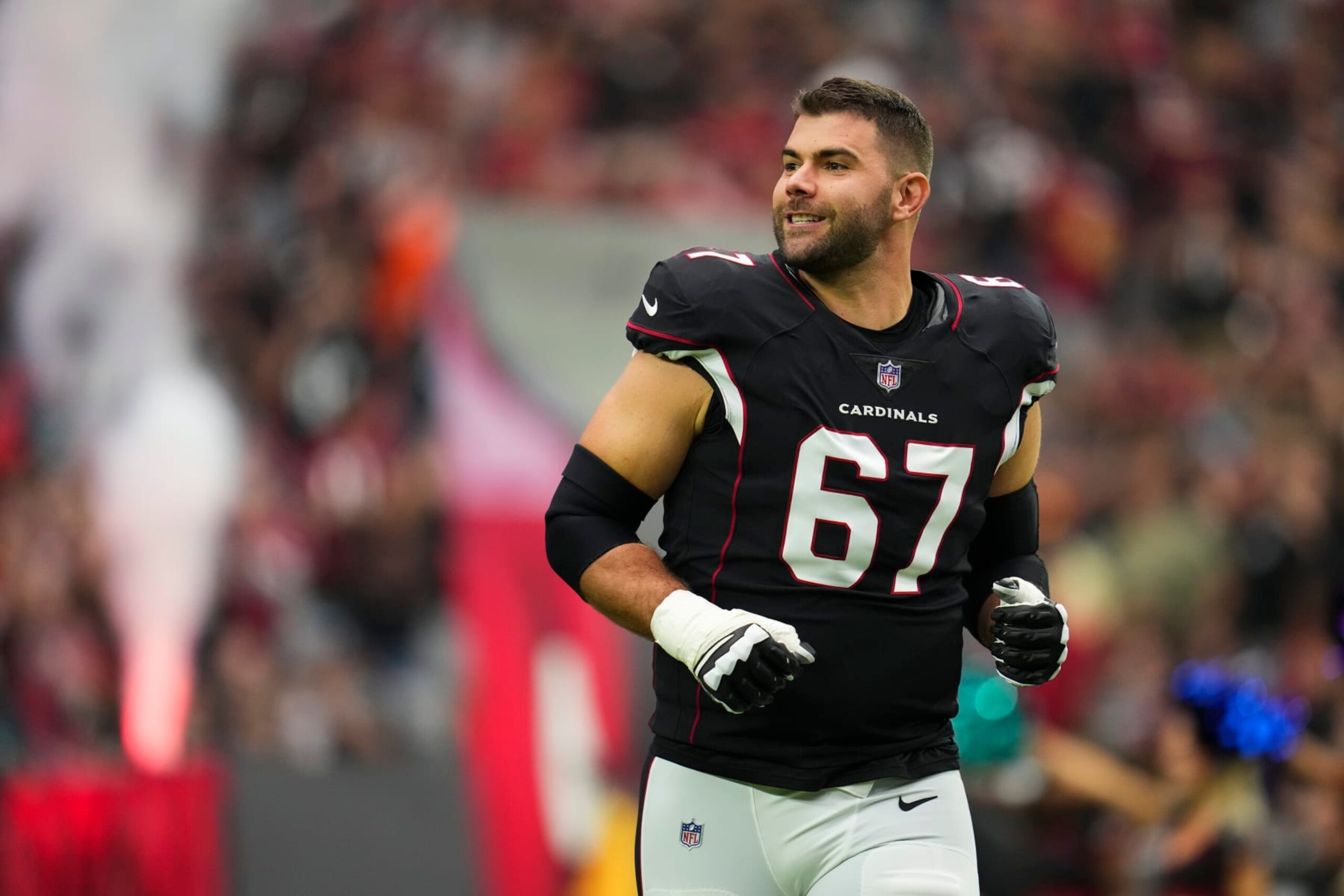 GLENDALE, AZ - OCTOBER 09: Justin Pugh #67 of the Arizona Cardinals runs out during introductions against the Philadelphia Eagles at State Farm Stadium on October 9, 2022 in Glendale, Arizona. (Photo by Cooper Neill/Getty Images)