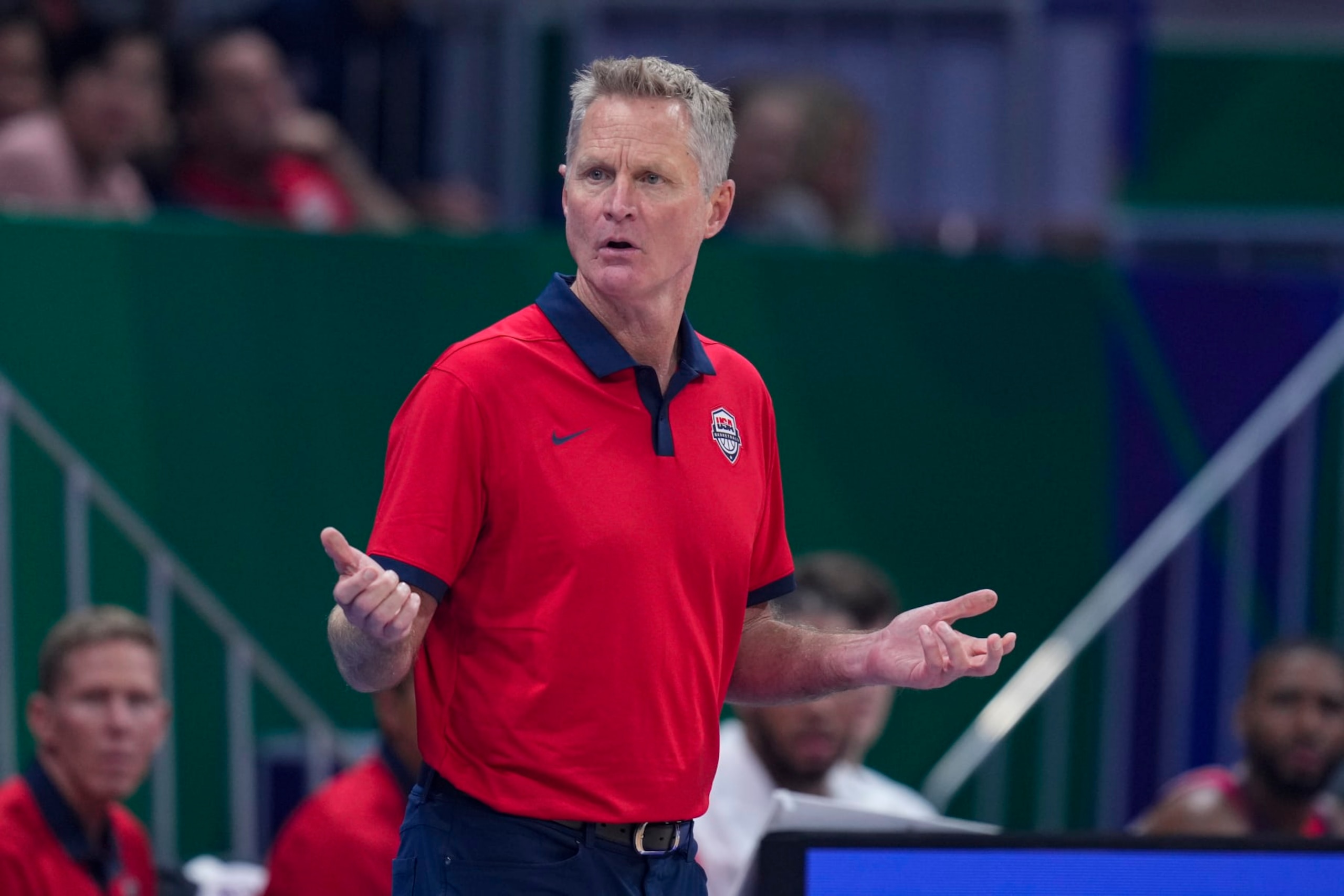 U.S. head coach Steve Kerr questions a call during the first half of a Basketball World Cup group C match against New Zealand in Manila, Saturday, Aug. 26, 2023. (AP Photo/Michael Conroy)