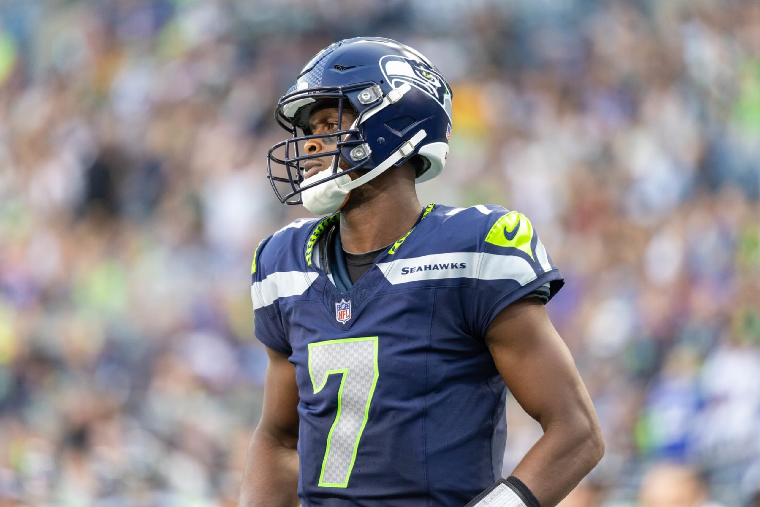 SEATTLE, WASHINGTON - AUGUST 19: Geno Smith #7 of the Seattle Seahawks walks on the field against the Dallas Cowboys during a preseason game at Lumen Field on August 19, 2023 in Seattle, Washington. (Photo by Tom Hauck/Getty Images)