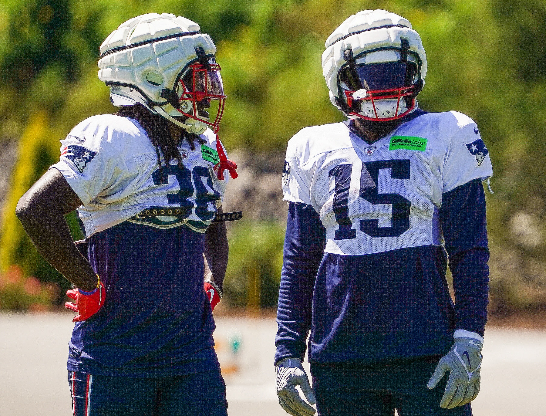 Foxborough, MA - August 23: New England Patriots RBs Rhamondre Stevenson, left, and Ezekiel Elliott chat. (Photo by Barry Chin/The Boston Globe via Getty Images)