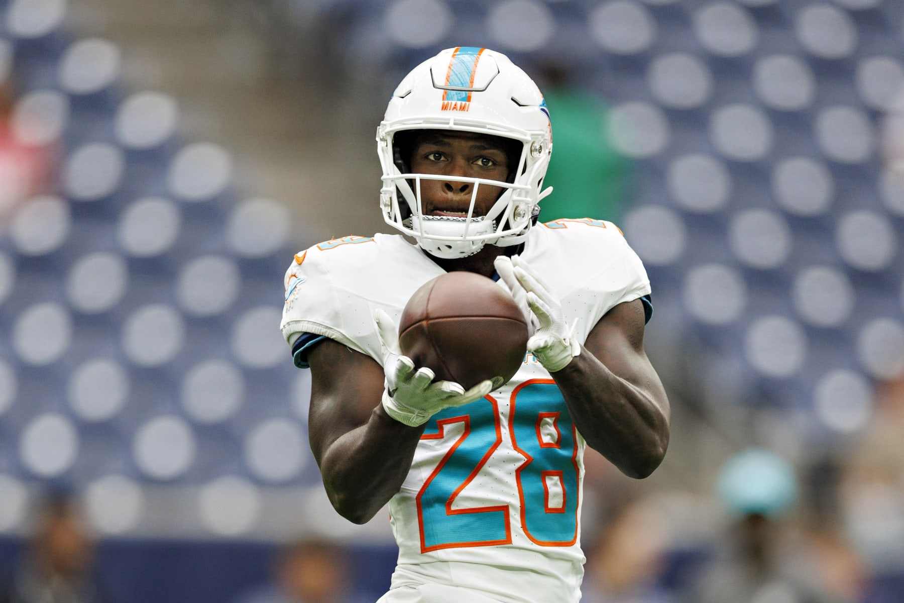 HOUSTON, TEXAS - AUGUST 19:  DeVon Achane #28 of the Miami Dolphins warms up before the preseason game against the Houston Texans at NRG Stadium on August 19, 2023 in Houston, Texas. The Dolphins defeated the Texans 28-3.  (Photo by Wesley Hitt/Getty Images)