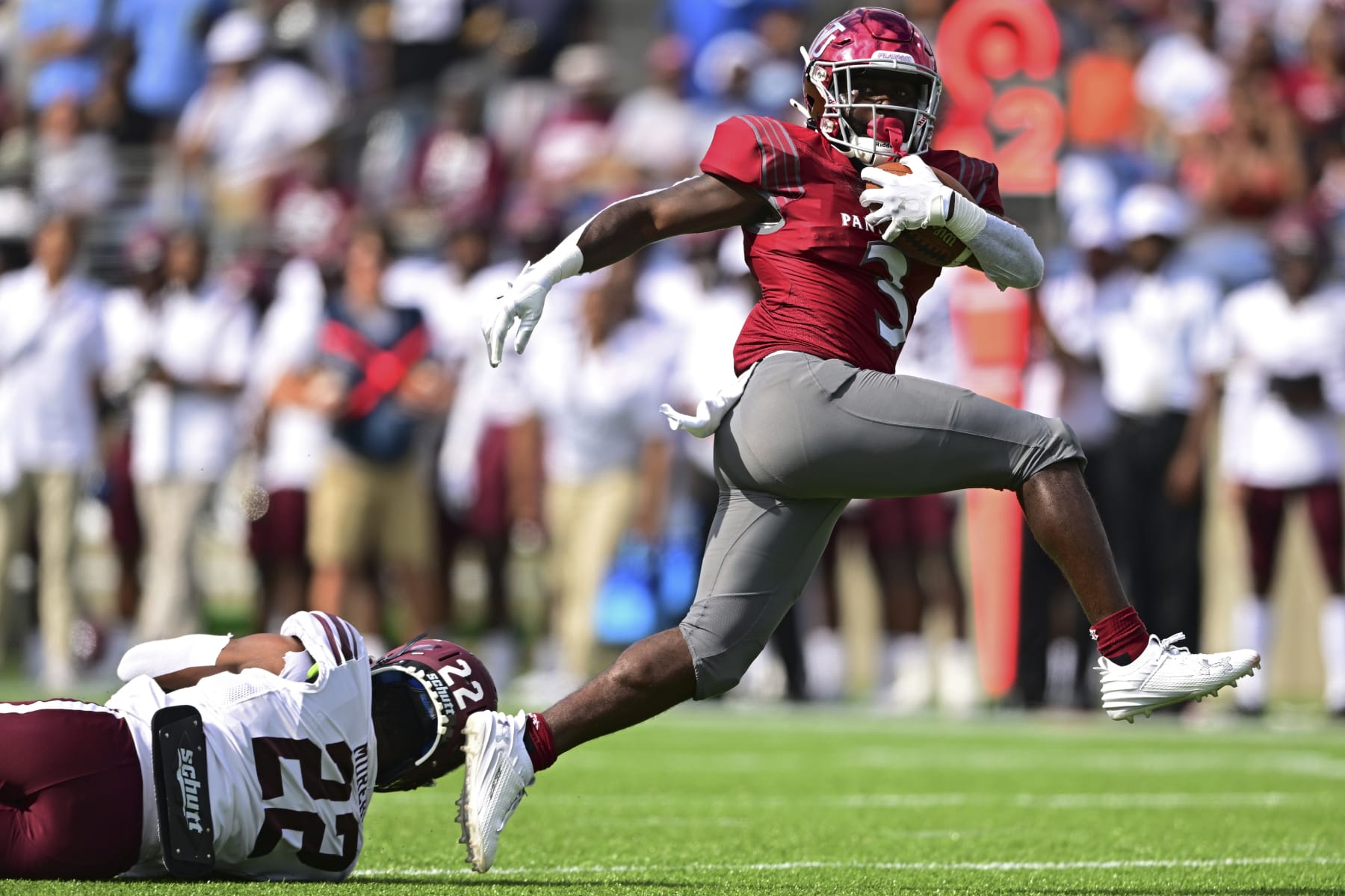 Virginia Union running back Jada Byers steps out of an attempted tackle by Morehouse defensive back Cameron Selders to score a 29-yard touchdown during the first quarter of an NCAA college football game, Sunday, Sept. 3, 2023, in Canton, Ohio. (AP Photo/David Dermer)