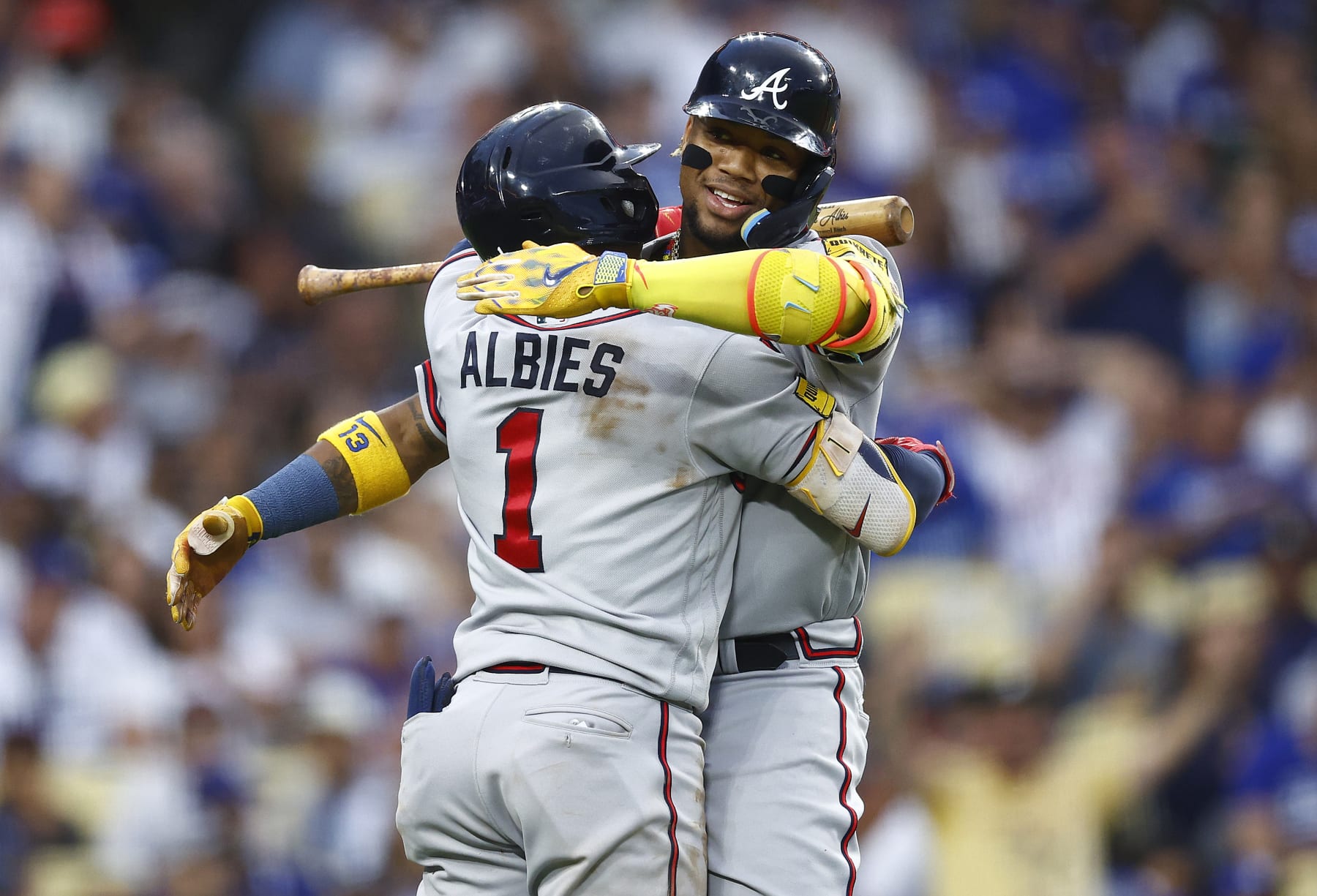 LOS ANGELES, CALIFORNIA - SEPTEMBER 02:  Ronald Acuna Jr. #13 of the Atlanta Braves celebrates with Ozzie Albies #1 after hitting a home run against the Los Angeles Dodgers in the third inning at Dodger Stadium on September 02, 2023 in Los Angeles, California. (Photo by Ronald Martinez/Getty Images)