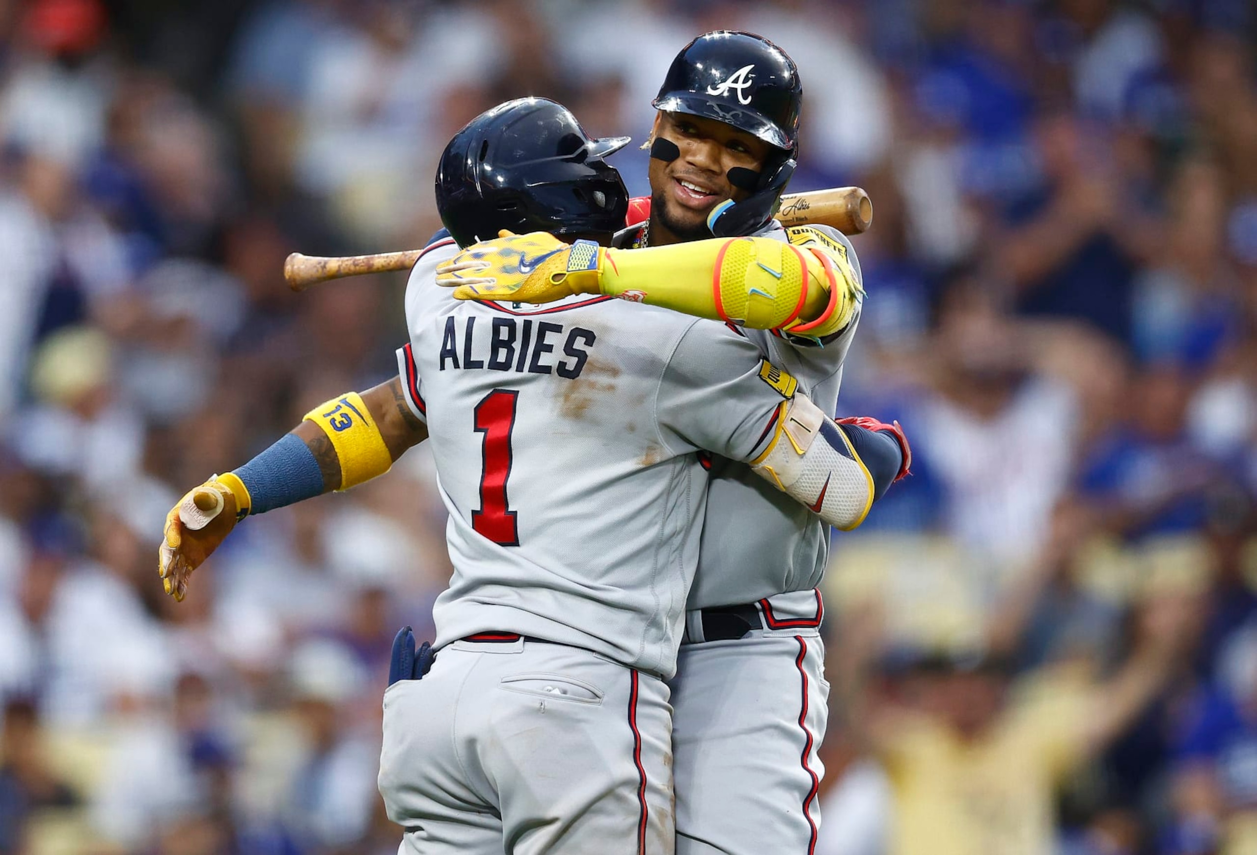 LOS ANGELES, CALIFORNIA - SEPTEMBER 02:  Ronald Acuna Jr. #13 of the Atlanta Braves celebrates with Ozzie Albies #1 after hitting a home run against the Los Angeles Dodgers in the third inning at Dodger Stadium on September 02, 2023 in Los Angeles, California. (Photo by Ronald Martinez/Getty Images)