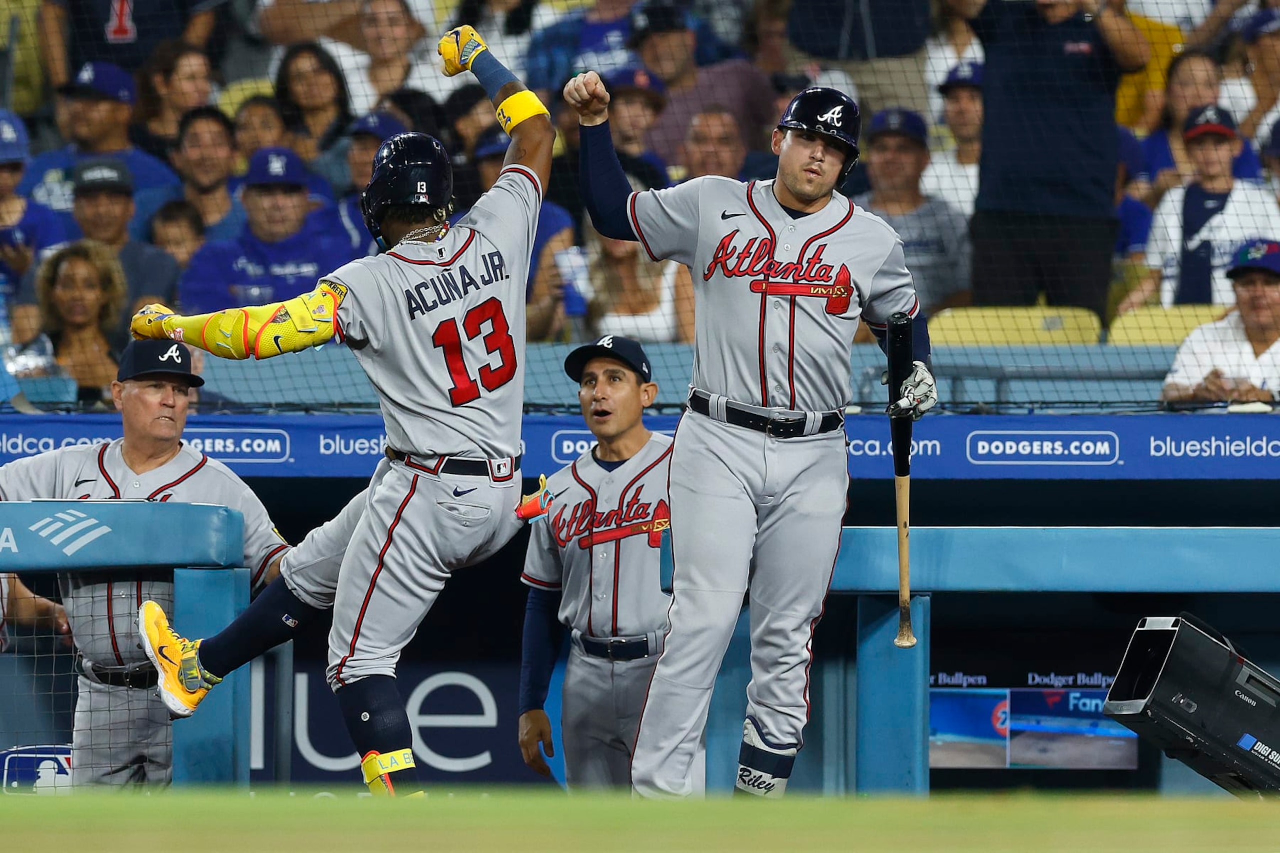 LOS ANGELES, CALIFORNIA - SEPTEMBER 01:  Ronald Acuna Jr. #13 of the Atlanta Braves celebrates a home run with Austin Riley #27 against the Los Angeles Dodgers in the third inning at Dodger Stadium on September 01, 2023 in Los Angeles, California. (Photo by Ronald Martinez/Getty Images)