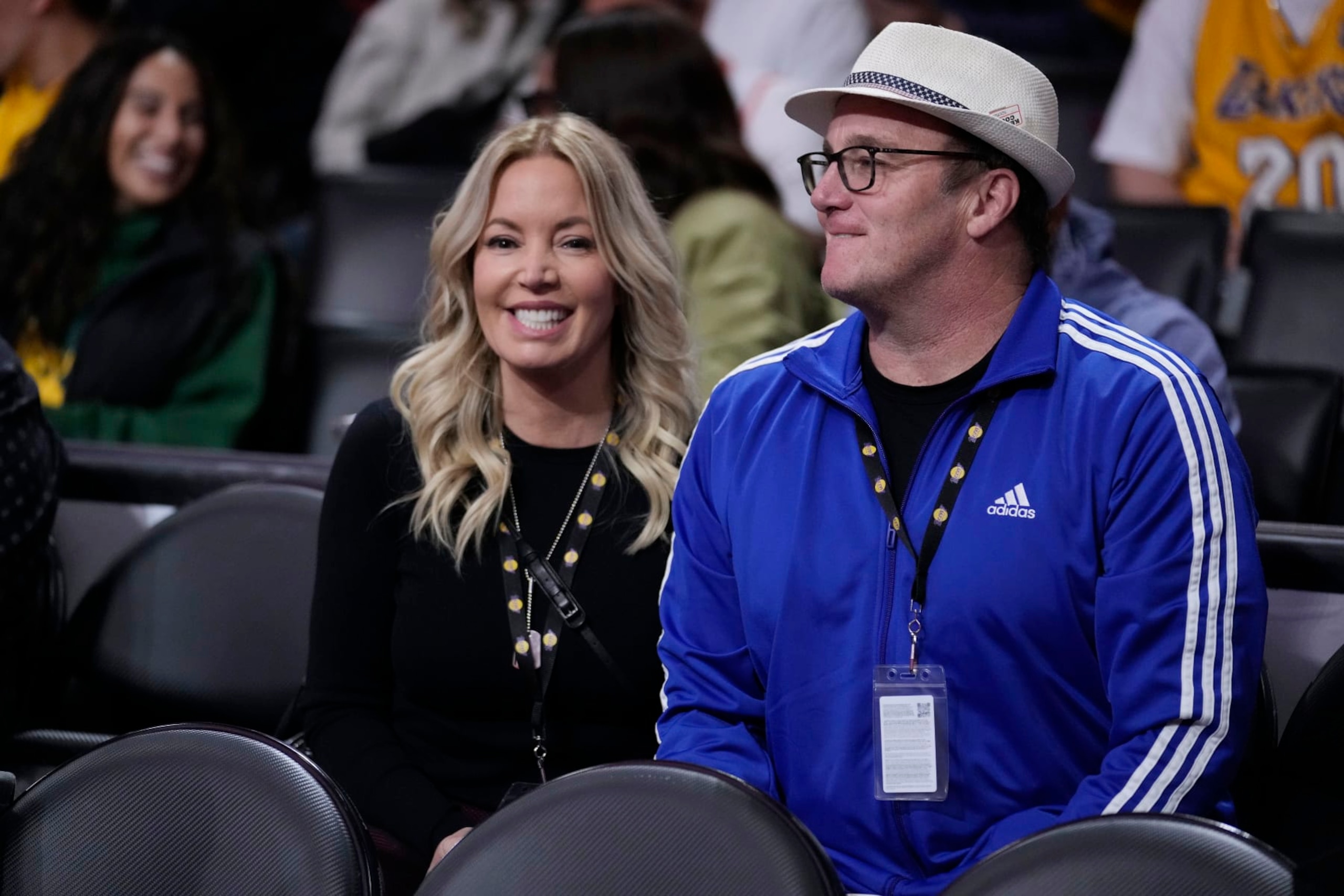 Los Angeles Lakers owner Jeanie Buss, left, sits with her fiancee Jay Mohr before an NBA basketball game against the Toronto Raptors Friday, March 10, 2023, in Los Angeles. (AP Photo/Marcio Jose Sanchez)
