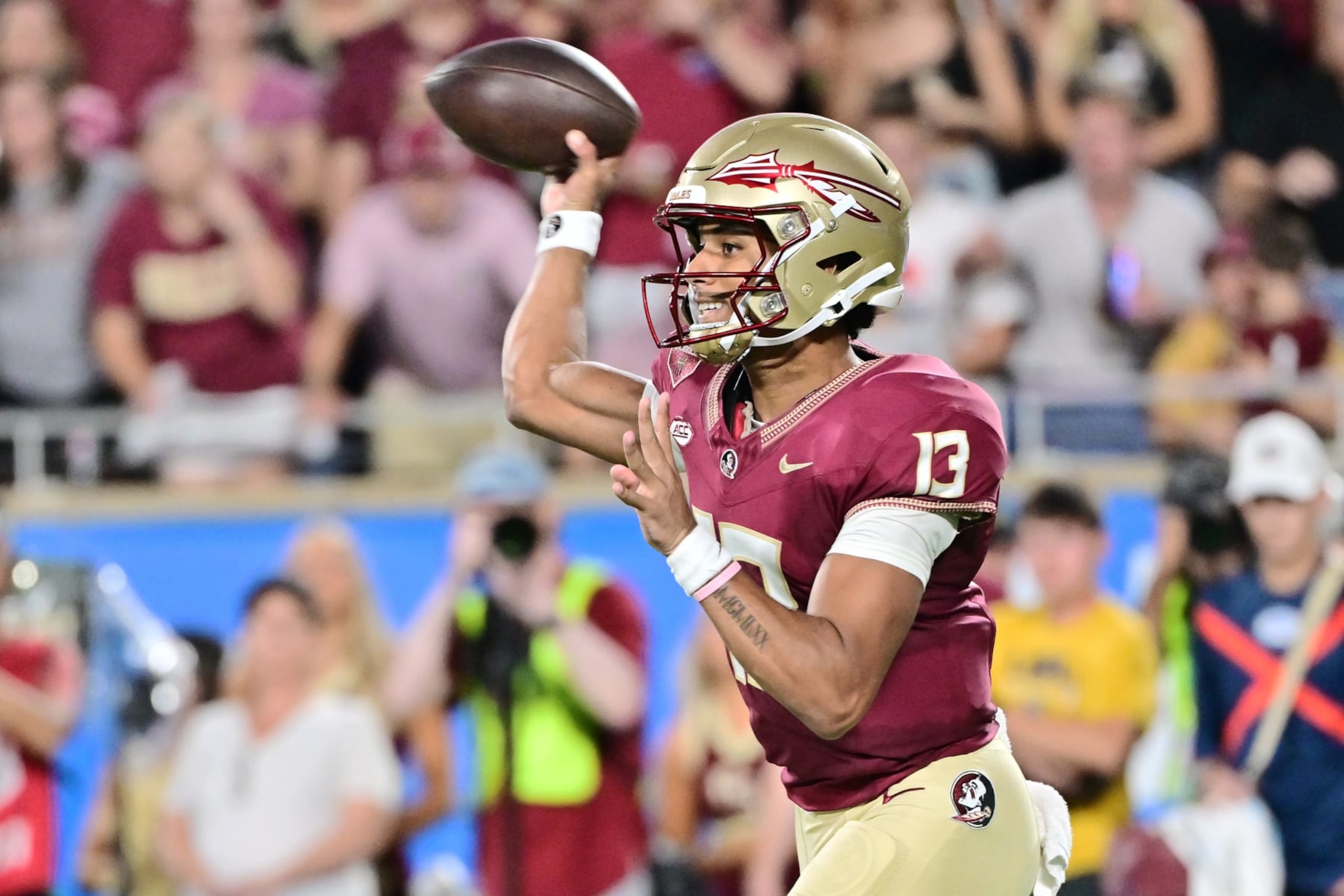 ORLANDO, FLORIDA - SEPTEMBER 03: Jordan Travis #13 of the Florida State Seminoles throws a pass in the first quarter against the LSU Tigers at Camping World Stadium on September 03, 2023 in Orlando, Florida. (Photo by Julio Aguilar/Getty Images)