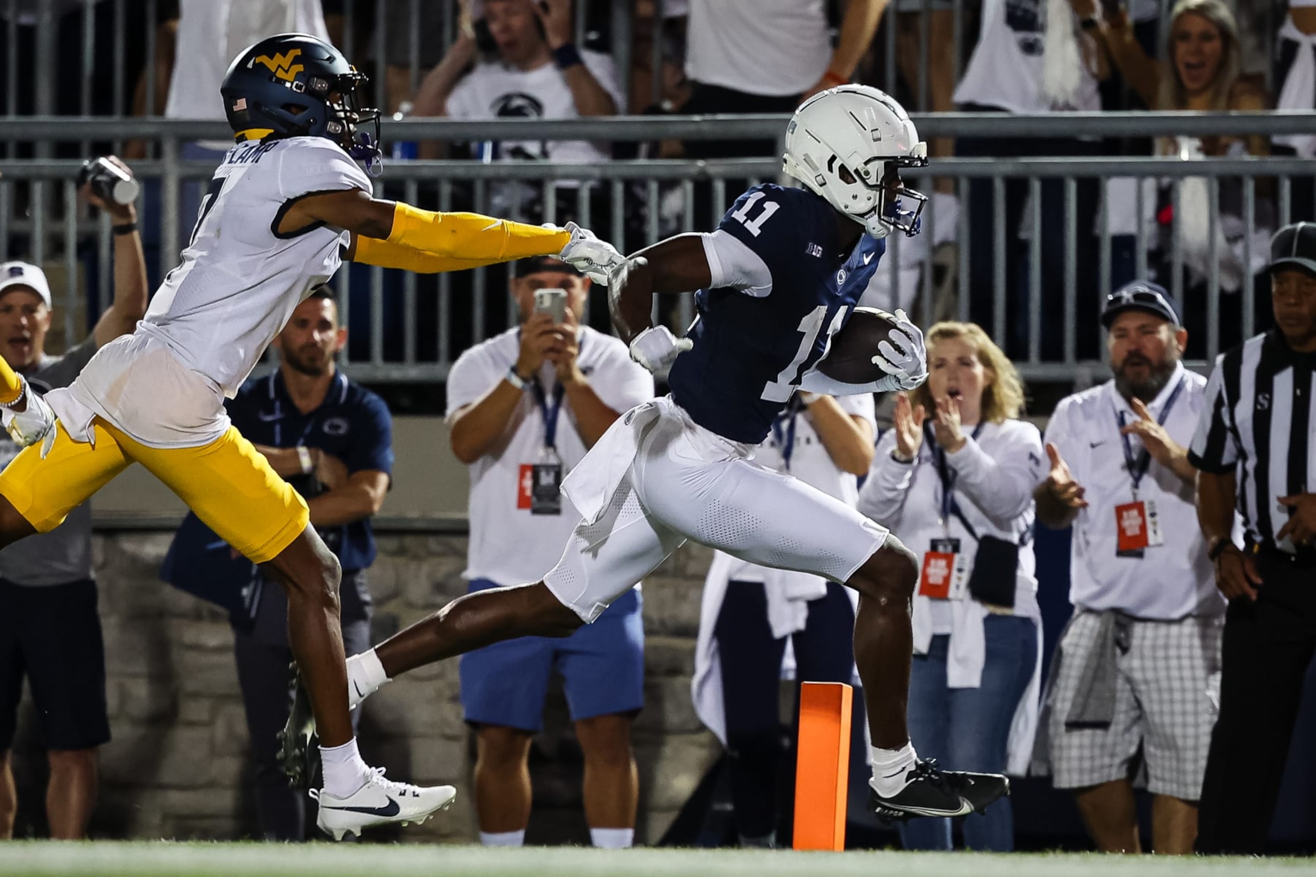 STATE COLLEGE, PA - SEPTEMBER 02: Malik McClain #11 of the Penn State Nittany Lions scores a touchdown in front of Andrew Wilson-Lamp #7 of the West Virginia Mountaineers during the second half at Beaver Stadium on September 2, 2023 in State College, Pennsylvania. (Photo by Scott Taetsch/Getty Images)