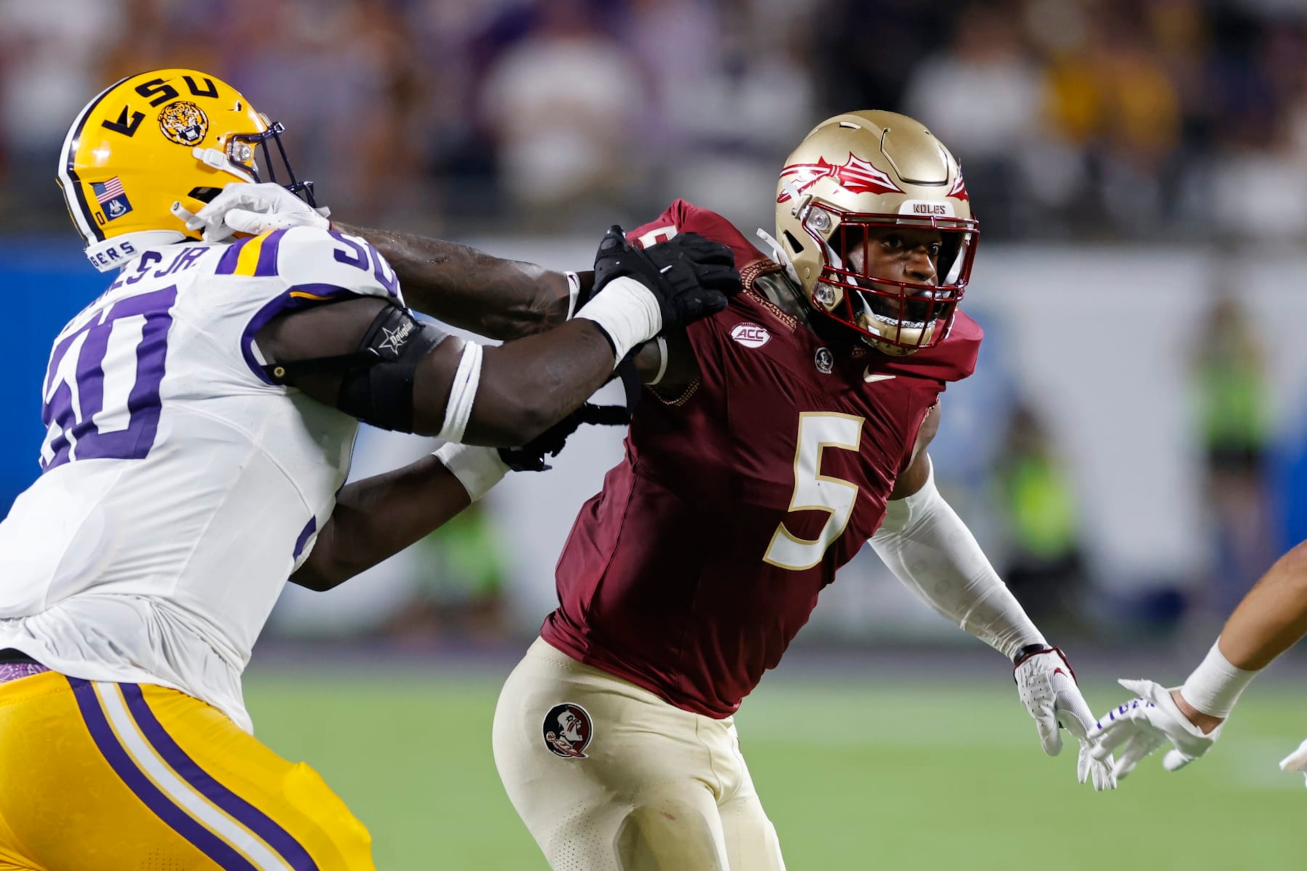 ORLANDO, FL - SEPTEMBER 03: Florida State Seminoles defensive lineman Jared Verse (5) rushes on defense while blocked by LSU Tigers offensive lineman Emery Jones Jr. (50) during a college football game on September 03, 2023 at Camping World Stadium in Orlando, Florida. (Photo by Joe Robbins/Icon Sportswire via Getty Images)