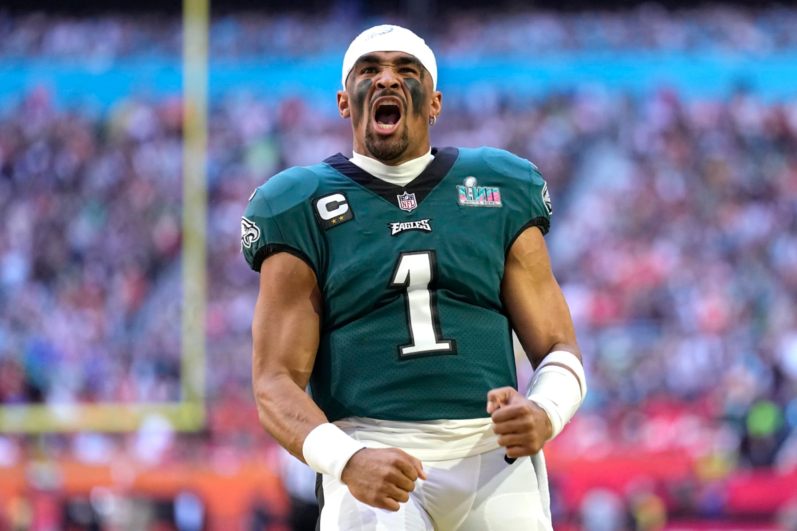 Philadelphia Eagles quarterback Jalen Hurts (1) cheers before the start of the NFL Super Bowl 57 football game between the Kansas City Chiefs and the Philadelphia Eagles, Sunday, Feb. 12, 2023, in Glendale, Ariz. (AP Photo/Abbie Parr)