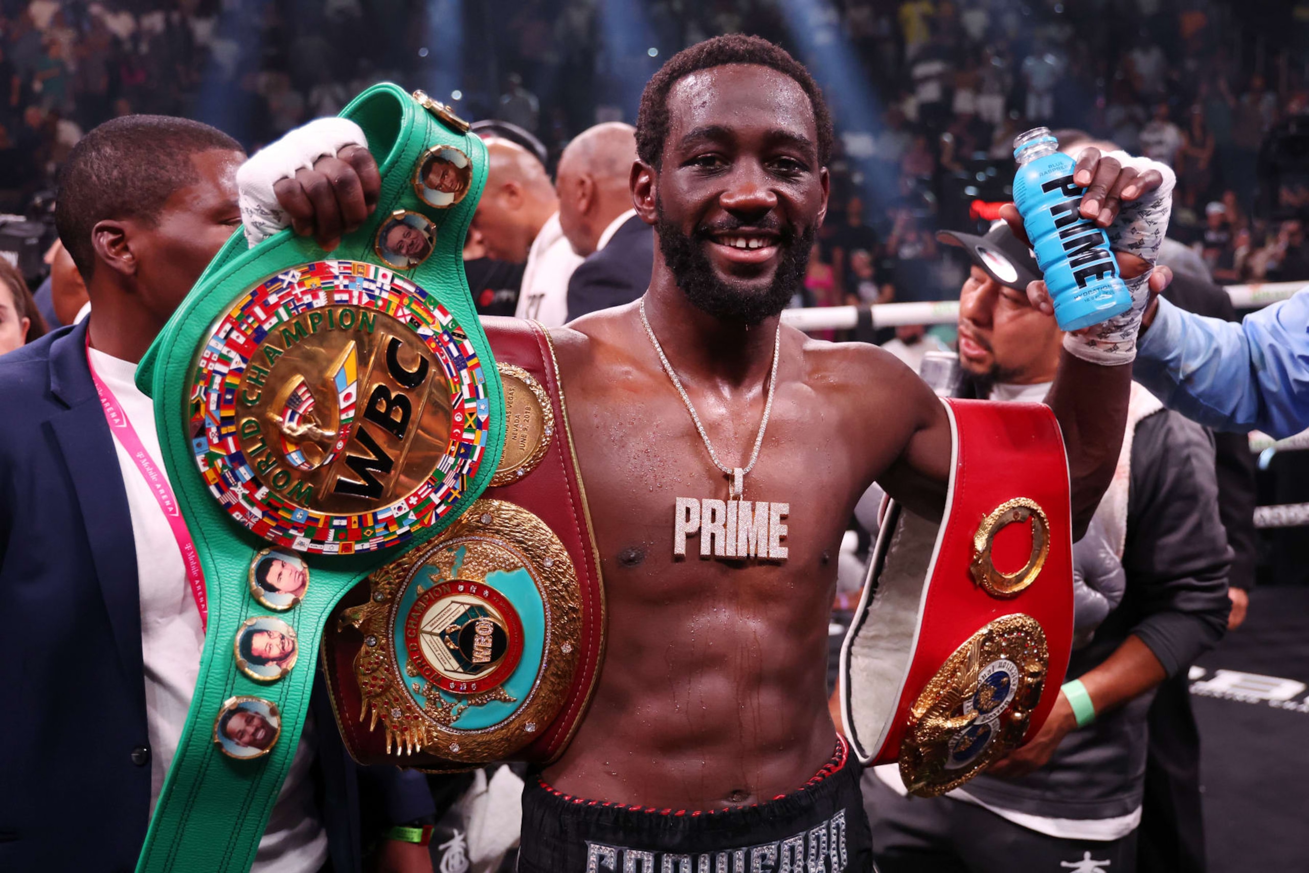 LAS VEGAS, NEVADA - JULY 29: Terence Crawford celebrates with his championship belts after defeating Errol Spence Jr. in the World Welterweight Championship bout at T-Mobile Arena on July 29, 2023 in Las Vegas, Nevada. (Photo by Al Bello/Getty Images) LAS VEGAS, NEVADA - JULY 29: Terence Crawford celebrates with his championship belts after defeating Errol Spence Jr. in the World Welterweight Championship bout at T-Mobile Arena on July 29, 2023 in Las Vegas, Nevada. (Photo by Al Bello/Getty Images)