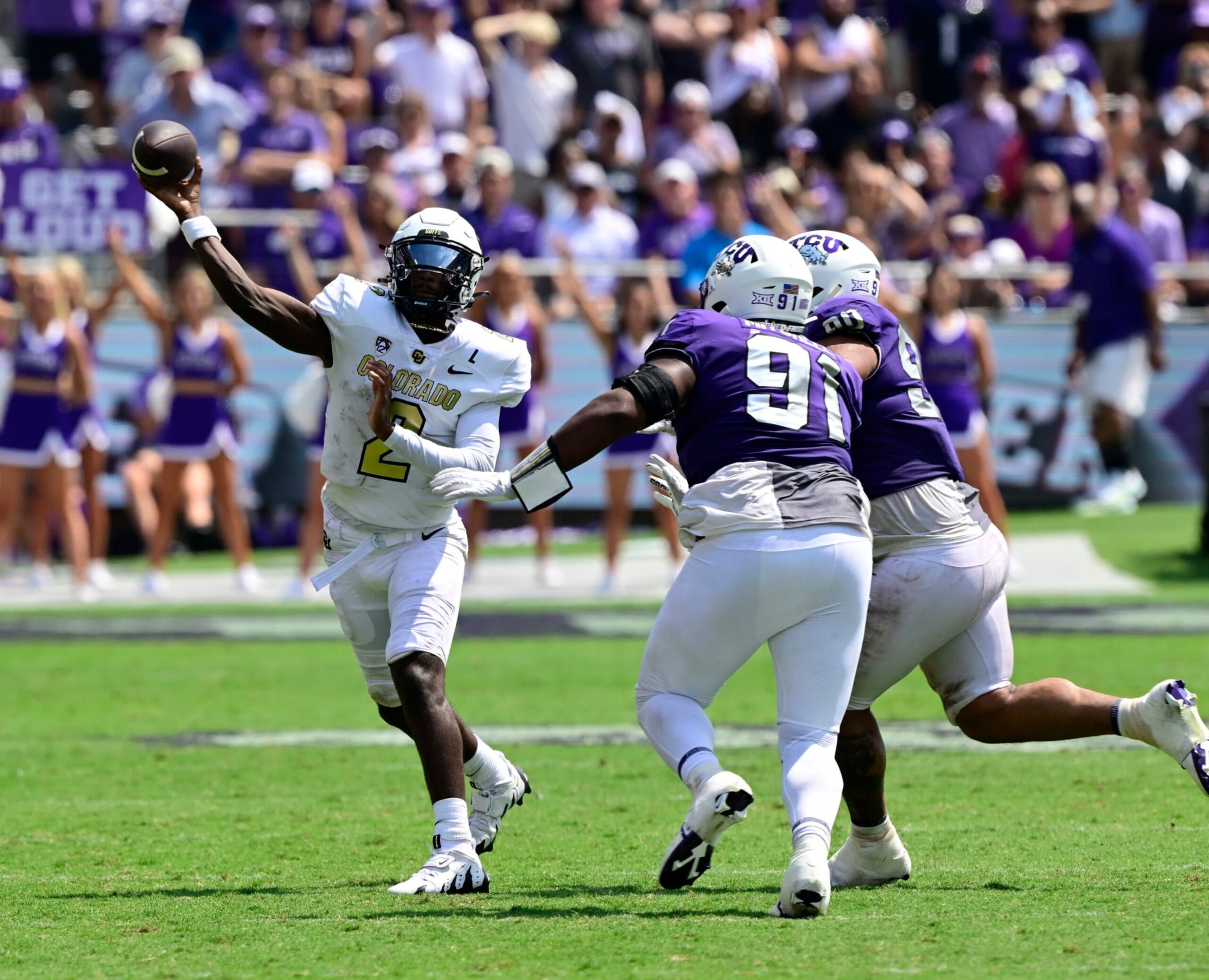 FT. WORTH, TX - SEPTEMBER 02: Colorado Buffaloes quarterback Shedeur Sanders (2) throws under pressure from TCU Horned Frogs defensive lineman Tymon Mitchell (91) and TCU Horned Frogs defensive lineman Caleb Fox (90) in the fourth quarter at Amon G. Carter Stadium in Ft. Worth September 02, 2023. (Photo by Andy Cross/MediaNews Group/The Denver Post via Getty Images)