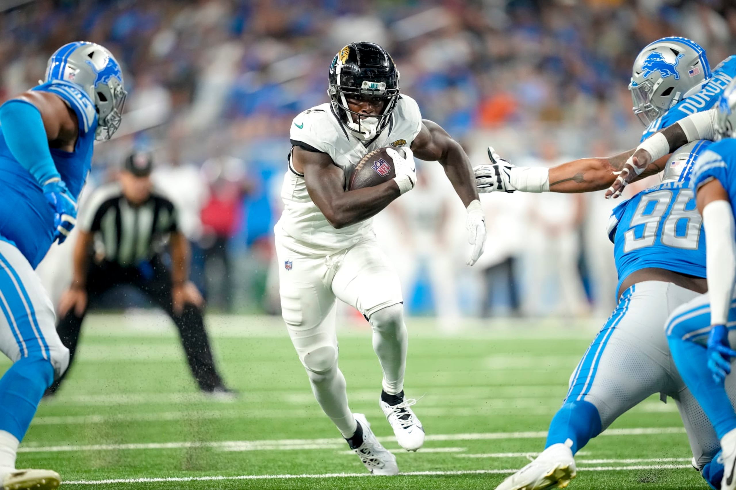 DETROIT, MICHIGAN - AUGUST 19: Tank Bigsby #4 of the Jacksonville Jaguars runs the ball against the Detroit Lions during the second quarter of the preseason game at Ford Field on August 19, 2023 in Detroit, Michigan. (Photo by Nic Antaya/Getty Images) DETROIT, MICHIGAN - AUGUST 19: Tank Bigsby #4 of the Jacksonville Jaguars runs the ball against the Detroit Lions during the second quarter of the preseason game at Ford Field on August 19, 2023 in Detroit, Michigan. (Photo by Nic Antaya/Getty Images)