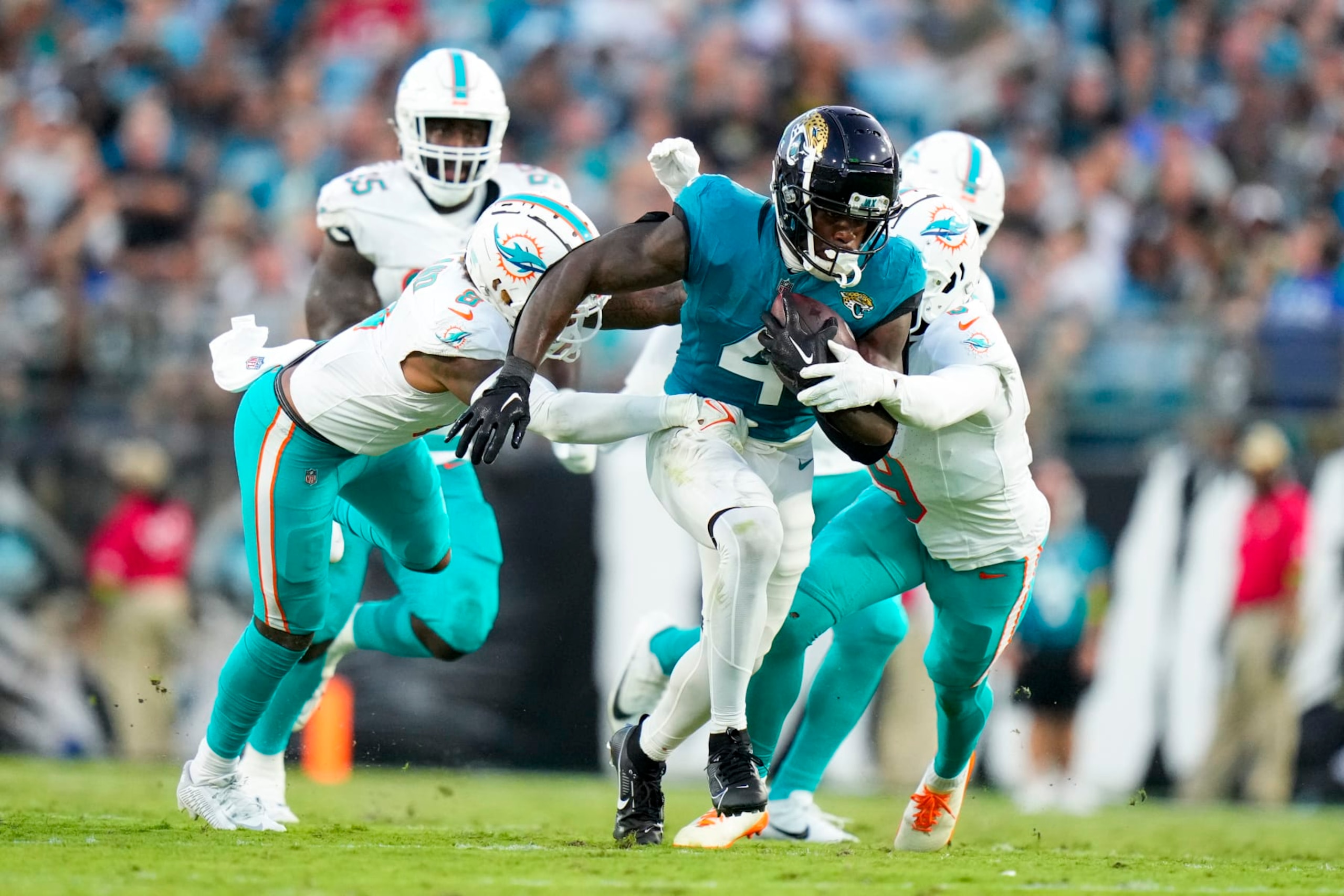 JACKSONVILLE, FLORIDA - AUGUST 26: Tank Bigsby #4 of the Jacksonville Jaguars runs the ball against the Miami Dolphins during the second quarter at TIAA Bank Field on August 26, 2023 in Jacksonville, Florida. (Photo by Rich Storry/Getty Images) JACKSONVILLE, FLORIDA - AUGUST 26: Tank Bigsby #4 of the Jacksonville Jaguars runs the ball against the Miami Dolphins during the second quarter at TIAA Bank Field on August 26, 2023 in Jacksonville, Florida. (Photo by Rich Storry/Getty Images)