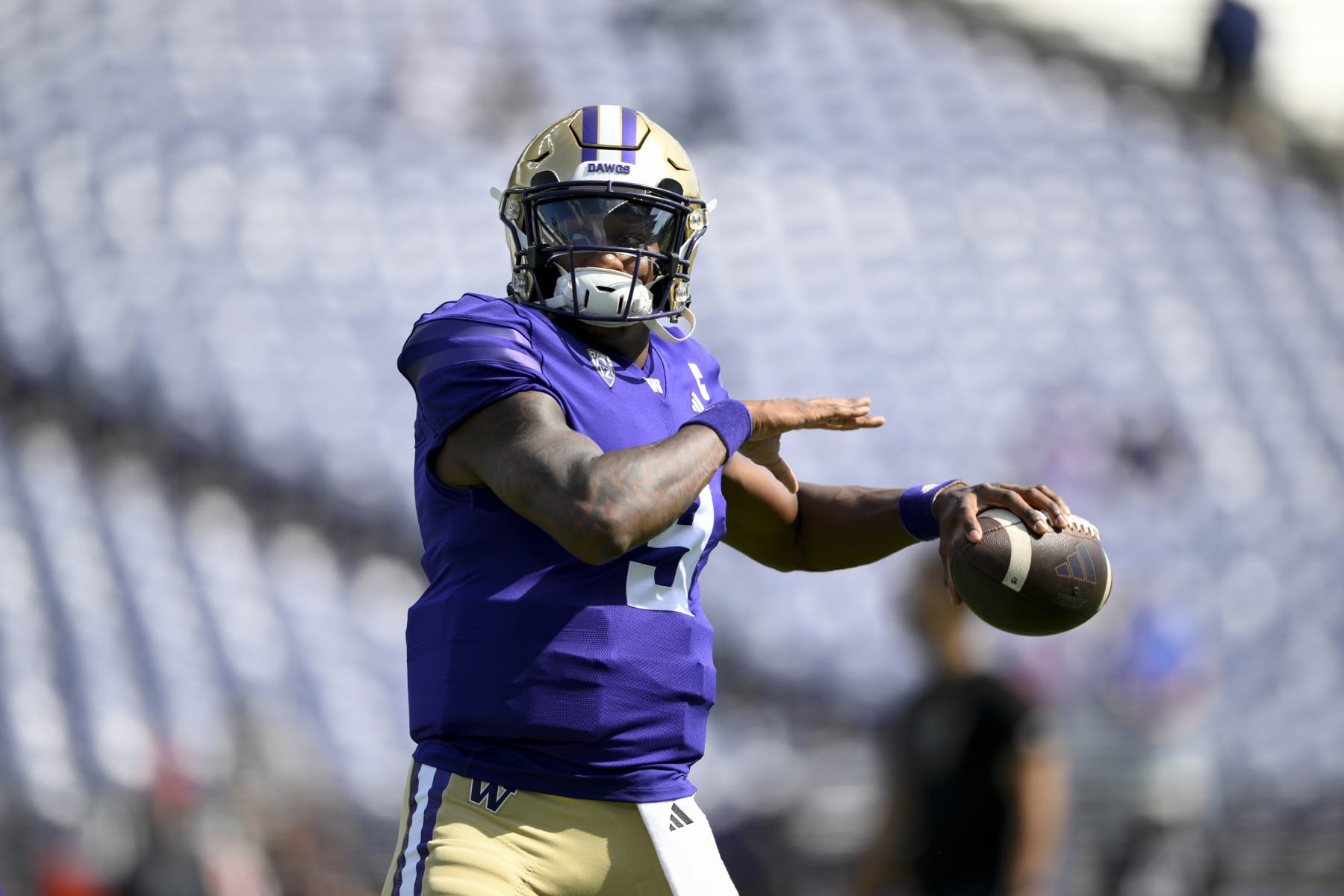 SEATTLE, WASHINGTON - SEPTEMBER 02: Michael Penix Jr. #9 of the Washington Huskies warms up before the game against the Boise State Broncos at Husky Stadium on September 02, 2023 in Seattle, Washington. (Photo by Alika Jenner/Getty Images)