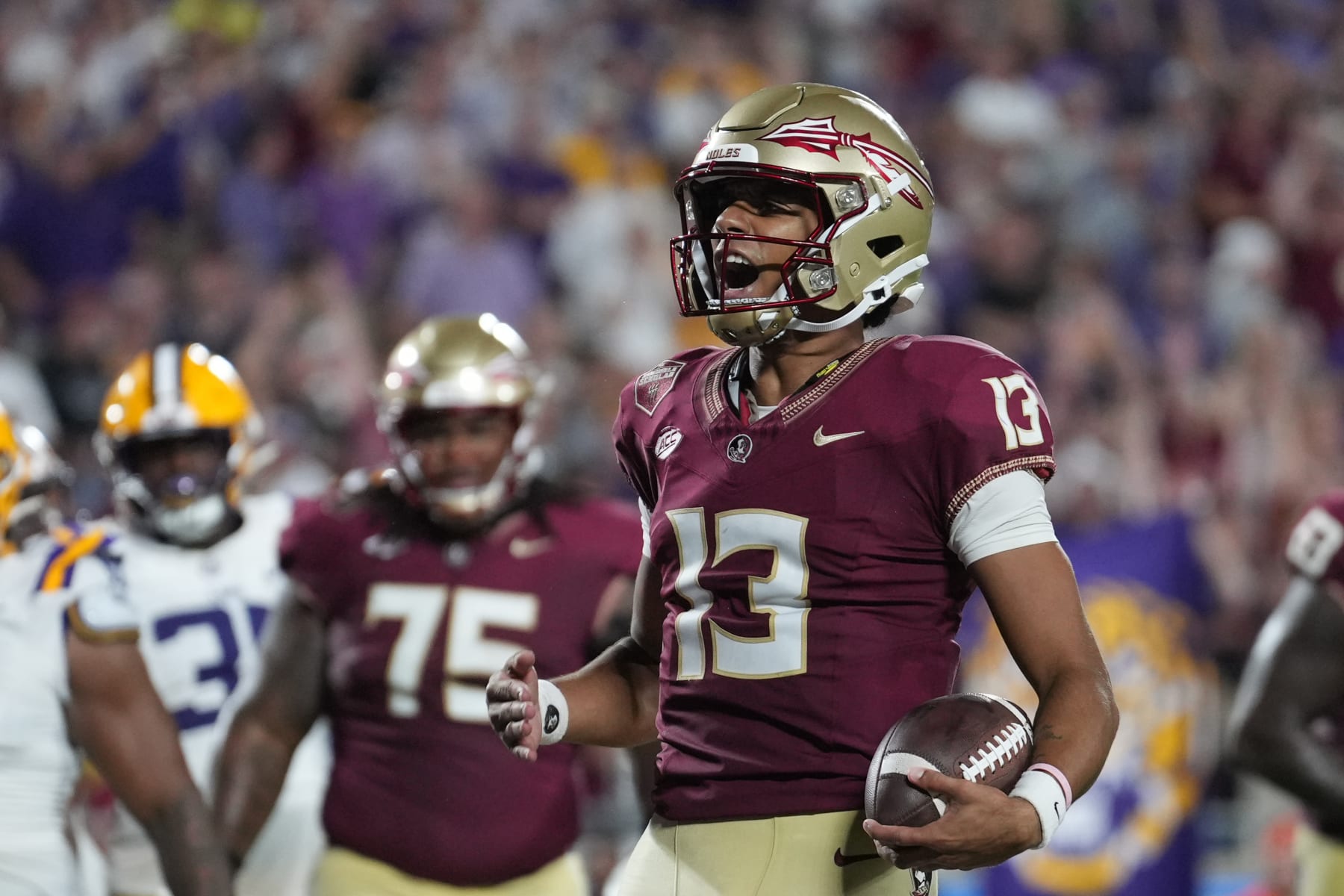 ORLANDO, FL - SEPTEMBER 03: Florida State Seminoles quarterback Jordan Travis (130 shouts in celebration after his rushing touchdown in the second half during the Camping World Kickoff game between the LSU Tigers and the Florida State Seminoles, on Sunday, September 3, 2023 at Camping World Stadium in Orlando, Fla. (Photo by Peter Joneleit/Icon Sportswire via Getty Images)