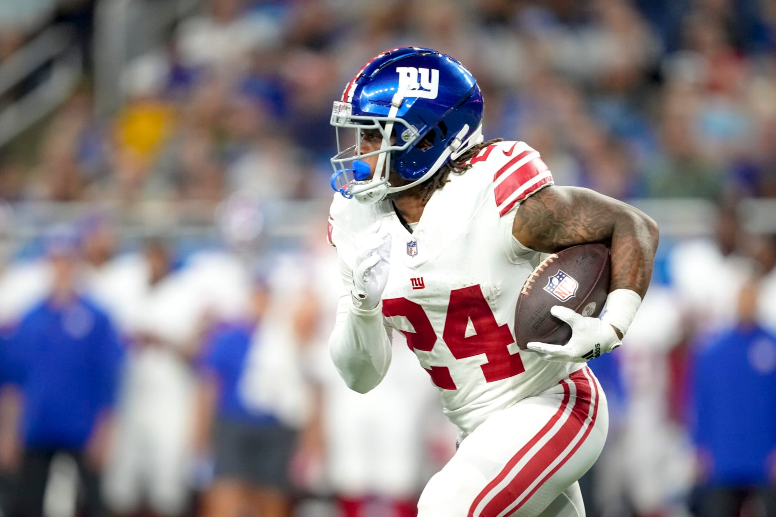 DETROIT, MICHIGAN - AUGUST 11: James Robinson #24 of the New York Giants runs the ball against the Detroit Lions during the first quarter of the preseason game at Ford Field on August 11, 2023 in Detroit, Michigan. (Photo by Nic Antaya/Getty Images)