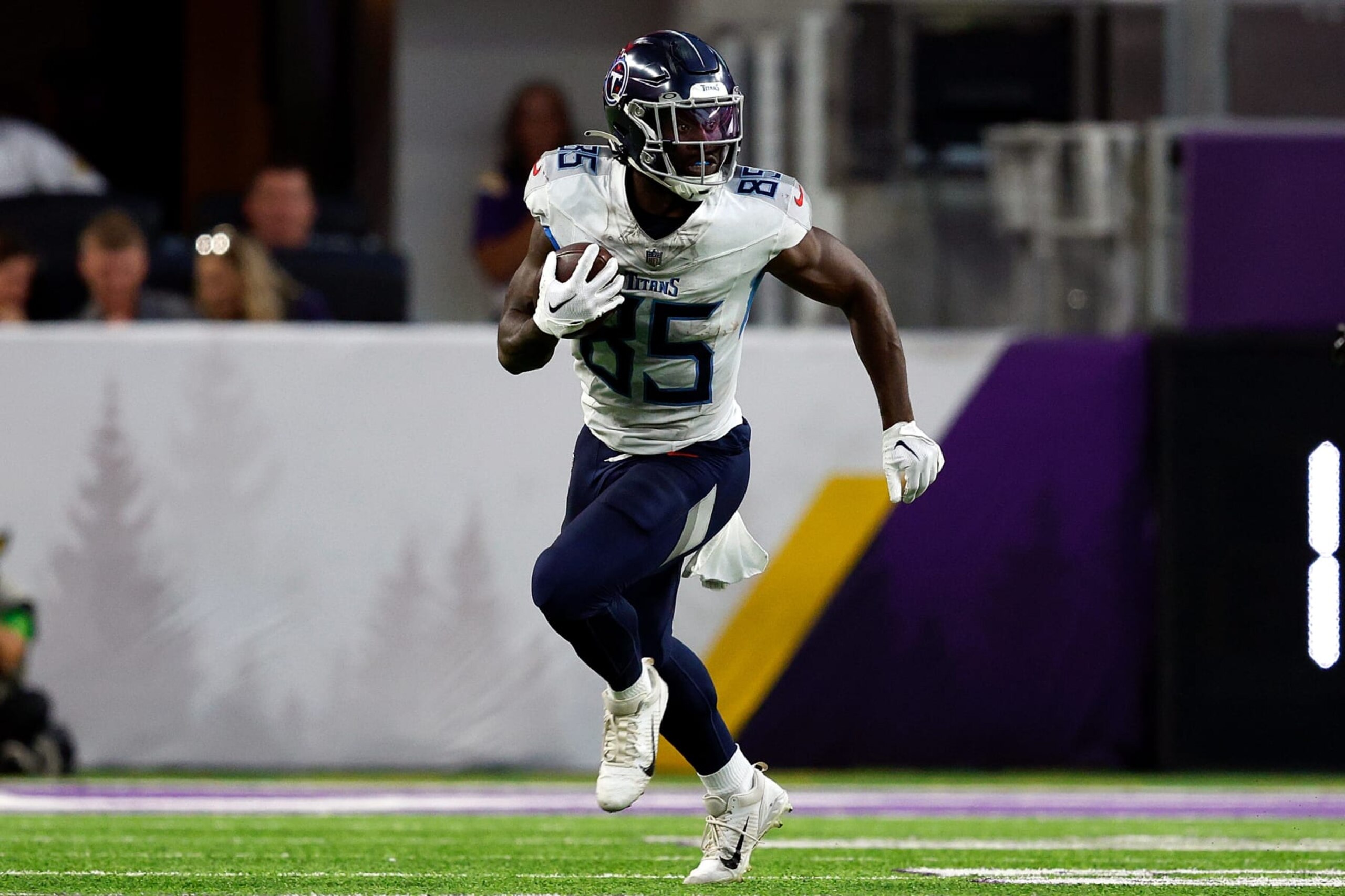 MINNEAPOLIS, MINNESOTA - AUGUST 19: Chigoziem Okonkwo #85 of the Tennessee Titans runs with the ball against the Minnesota Vikings in the first half during a preseason game at U.S. Bank Stadium on August 19, 2023 in Minneapolis, Minnesota. The Titans defeated the Vikings 24-16. (Photo by David Berding/Getty Images)
