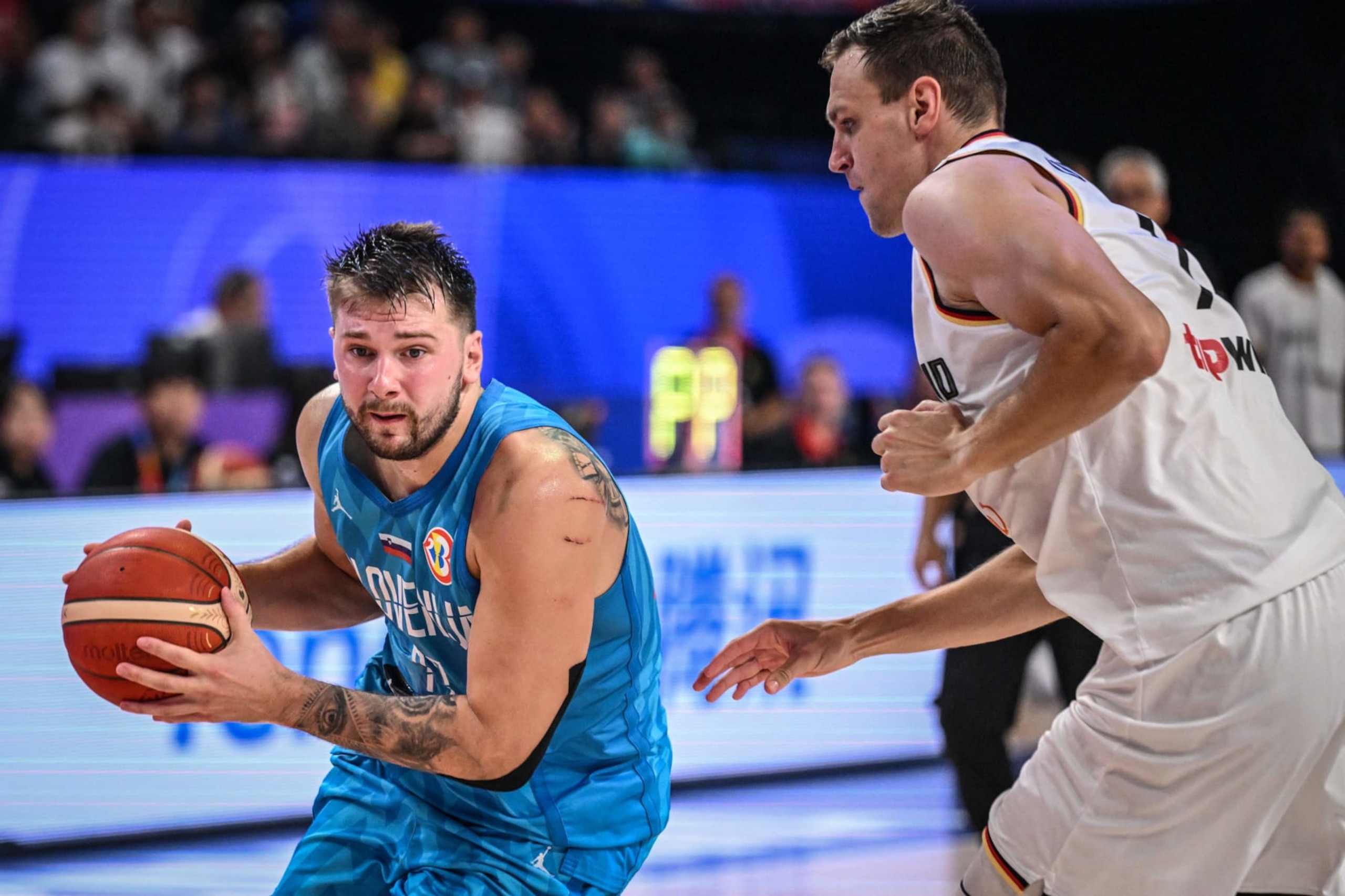 Slovenia's Luka Doncic drives to the basket during the FIBA Basketball World Cup group K match between Germany and Slovenia at Okinawa Arena in Okinawa on September 3, 2023. (Photo by Yuichi YAMAZAKI / AFP) (Photo by YUICHI YAMAZAKI/AFP via Getty Images)