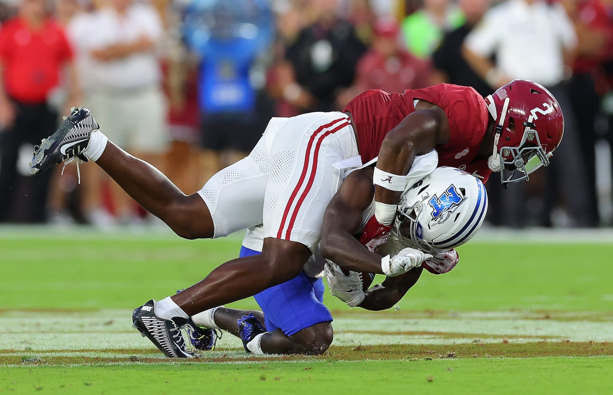 TUSCALOOSA, ALABAMA - SEPTEMBER 02:  Caleb Downs #2 of the Alabama Crimson Tide tackles m9during the first quarter at Bryant-Denny Stadium on September 02, 2023 in Tuscaloosa, Alabama. (Photo by Kevin C. Cox/Getty Images)