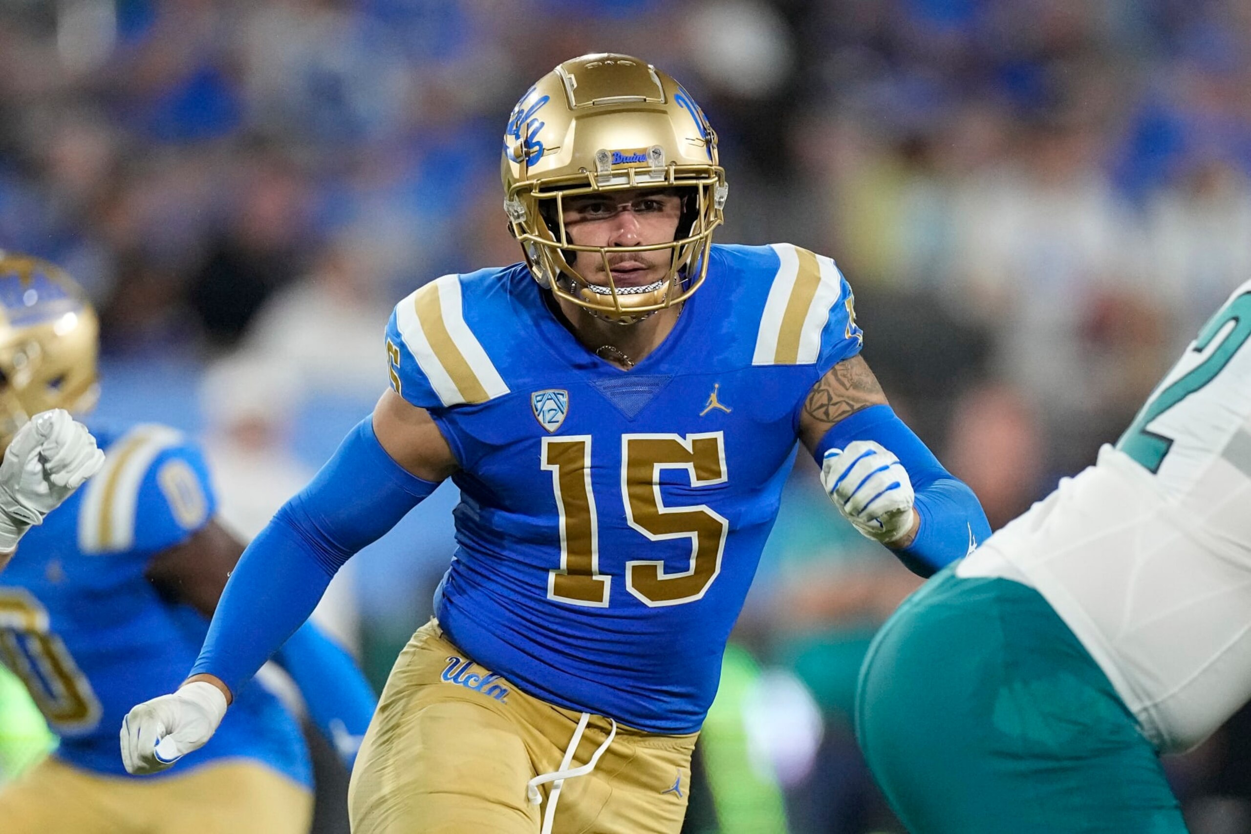 UCLA defensive lineman Laiatu Latu runs a play during the first half of an NCAA college football game against Coastal Carolina Saturday, Sept. 2, 2023, in Pasadena, Calif. (AP Photo/Mark J. Terrill)